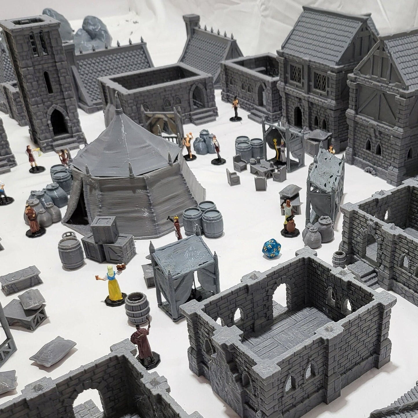 9 houses, 1 markettent, 1 clocktower, 6 market stalls, a fountain, and a street market. With everything you need in one shot, this will provide hours of fun for hobbyists & gamers. Get your hands on this fantastic set and bring your tabletop to life!