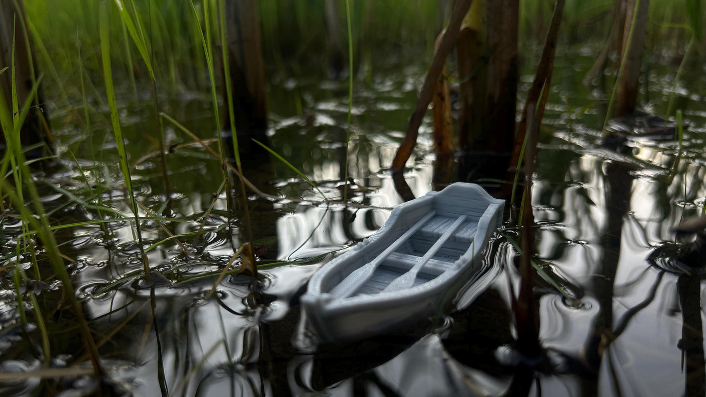 Set of 3 medieval rowboats with crates, barrels, sacks, ropes, and oars. Available in 15mm, 28mm, and 32mm scales—perfect for docks, rivers, and coastal scenes in fantasy and historical tabletop games.