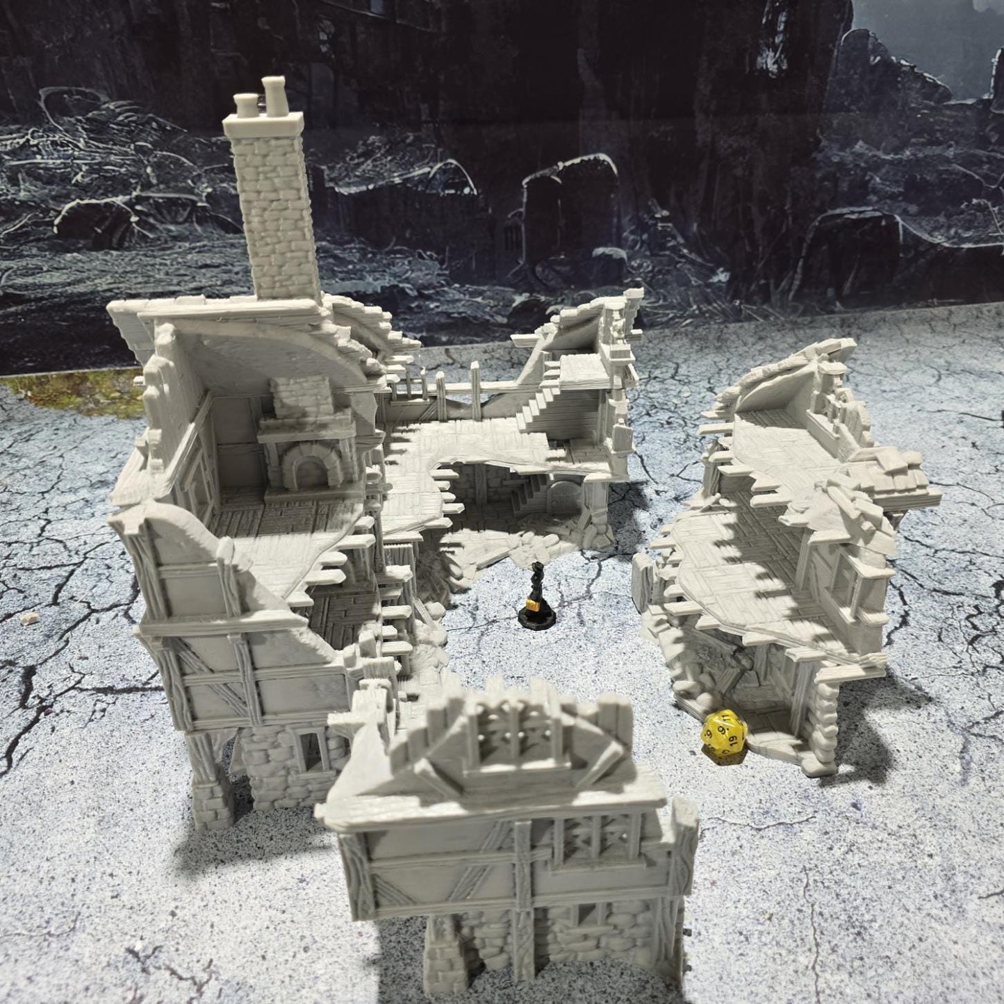 The Barrenfall Manor Ruins model features detailed remains of a medieval manor, complete with collapsed staircases, crumbling stone walls, and debris-filled rooms, perfect for creating an immersive, desolate atmosphere on your tabletop.