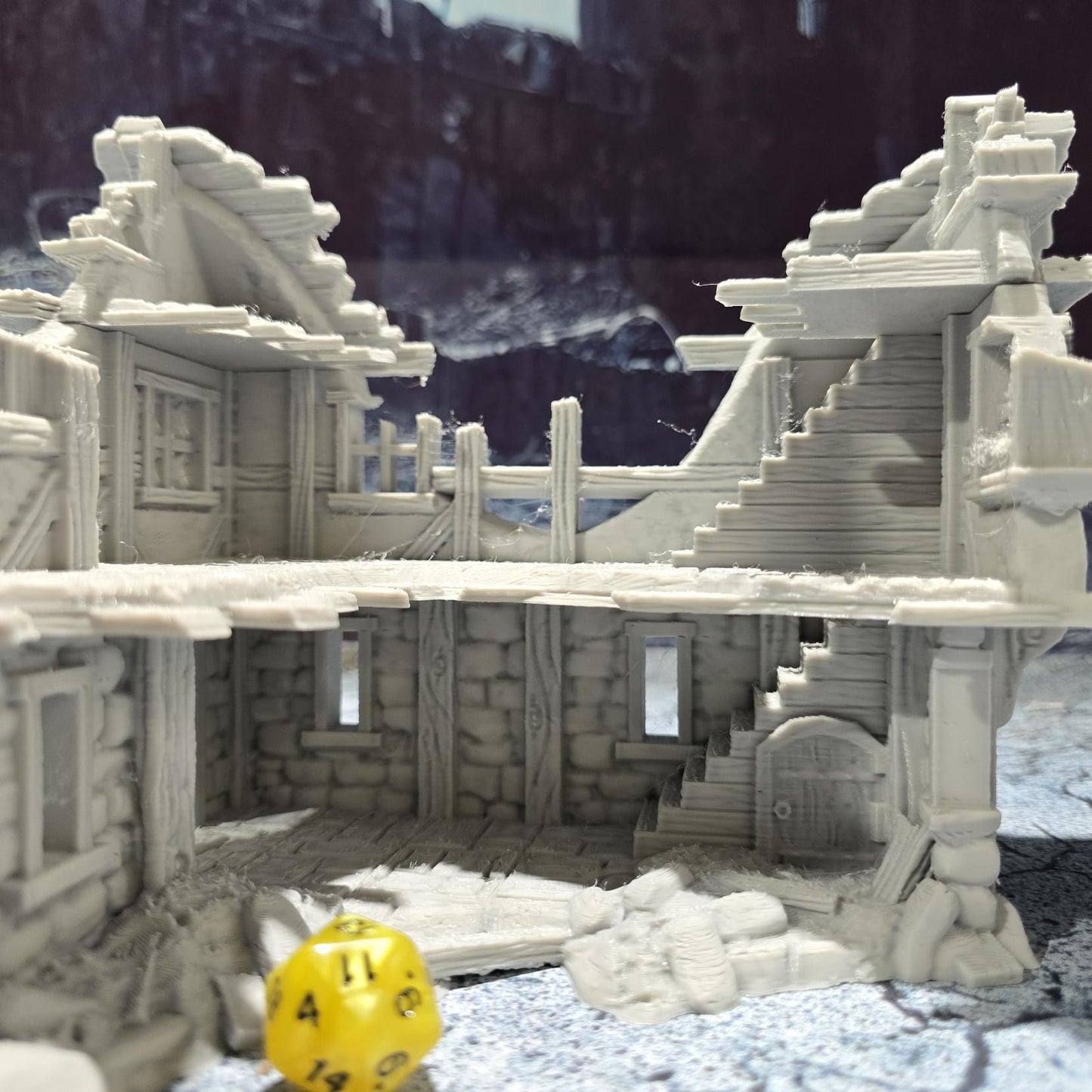 The Barrenfall Manor Ruins model features detailed remains of a medieval manor, complete with collapsed staircases, crumbling stone walls, and debris-filled rooms, perfect for creating an immersive, desolate atmosphere on your tabletop.
