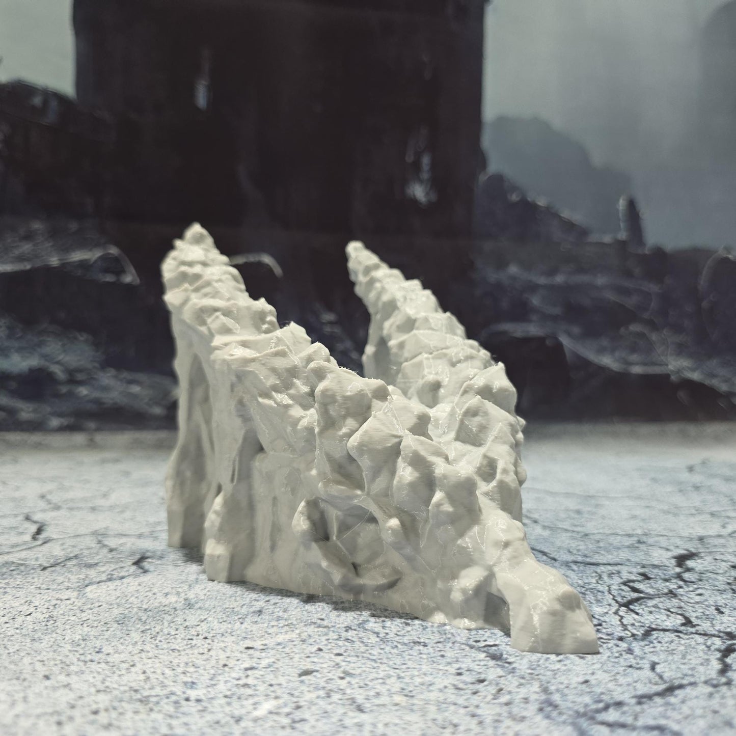 A meticulously crafted 3D model depicting a dragon's skull that serves as a cave entrance, set against a backdrop of ominous, dark castles and rugged terrains, perfect for enhancing medieval and fantasy-themed gaming sessions.