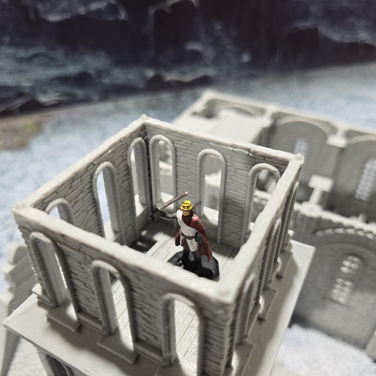 The Greendale Church of the Dale features a medieval gothic design with two angel statues and sets of pews, ideal for historical tabletop settings.