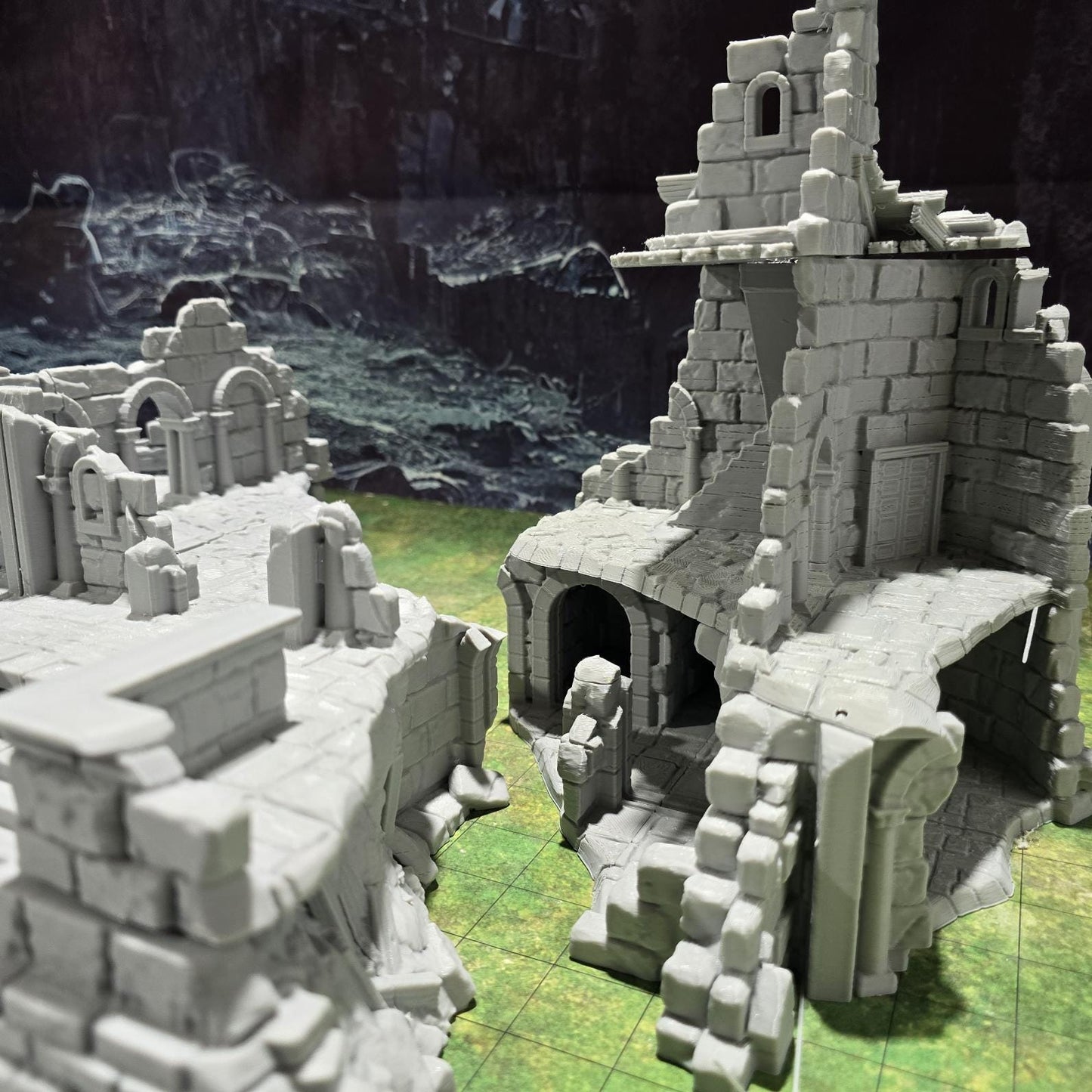 Explore the Arkenfel Barracks Building Ruin, featuring a medieval fortress design with detailed crumbling walls and strategic interior spaces, perfect for historical or fantasy tabletop games.