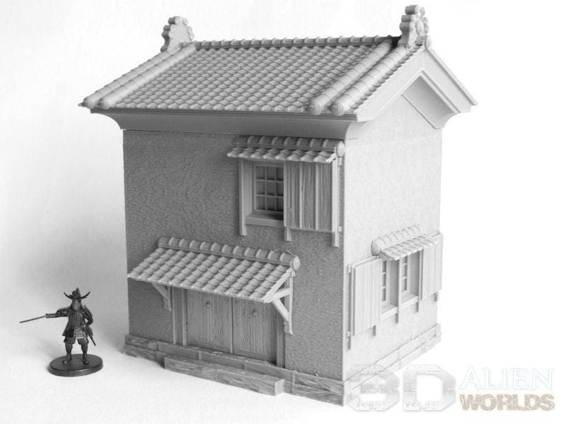 A small Samurai Lord's storehouse, complete with traditional tiled roof, wooden shutters, and sliding doors, perfect for feudal Japan-themed tabletop games or dioramas.
