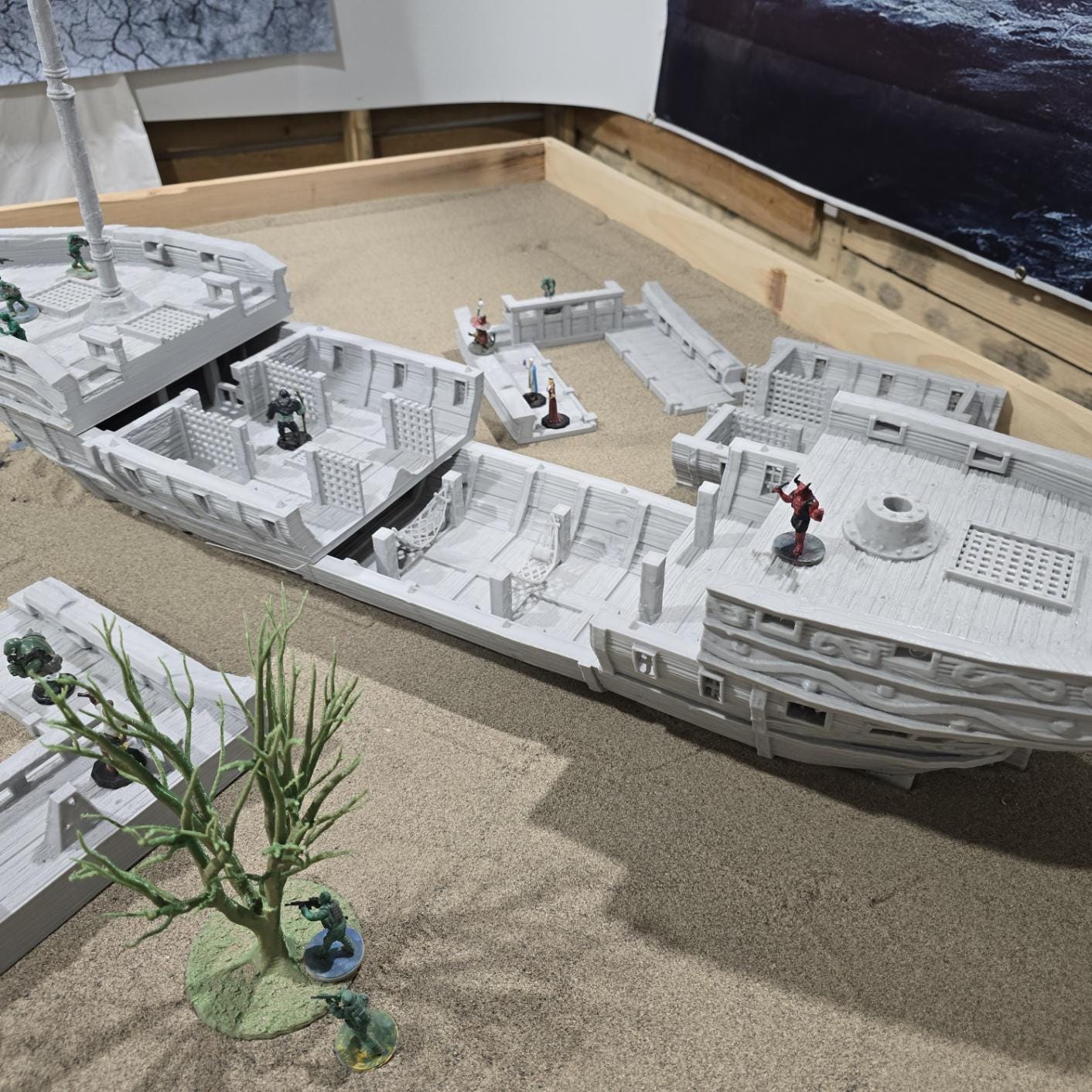 A detailed pirate slave ship model featuring three masts with skull and crossbones sails, wooden textures, and multiple playable levels, including a mid-deck with slave cells, perfect for historical and fantasy tabletop games.