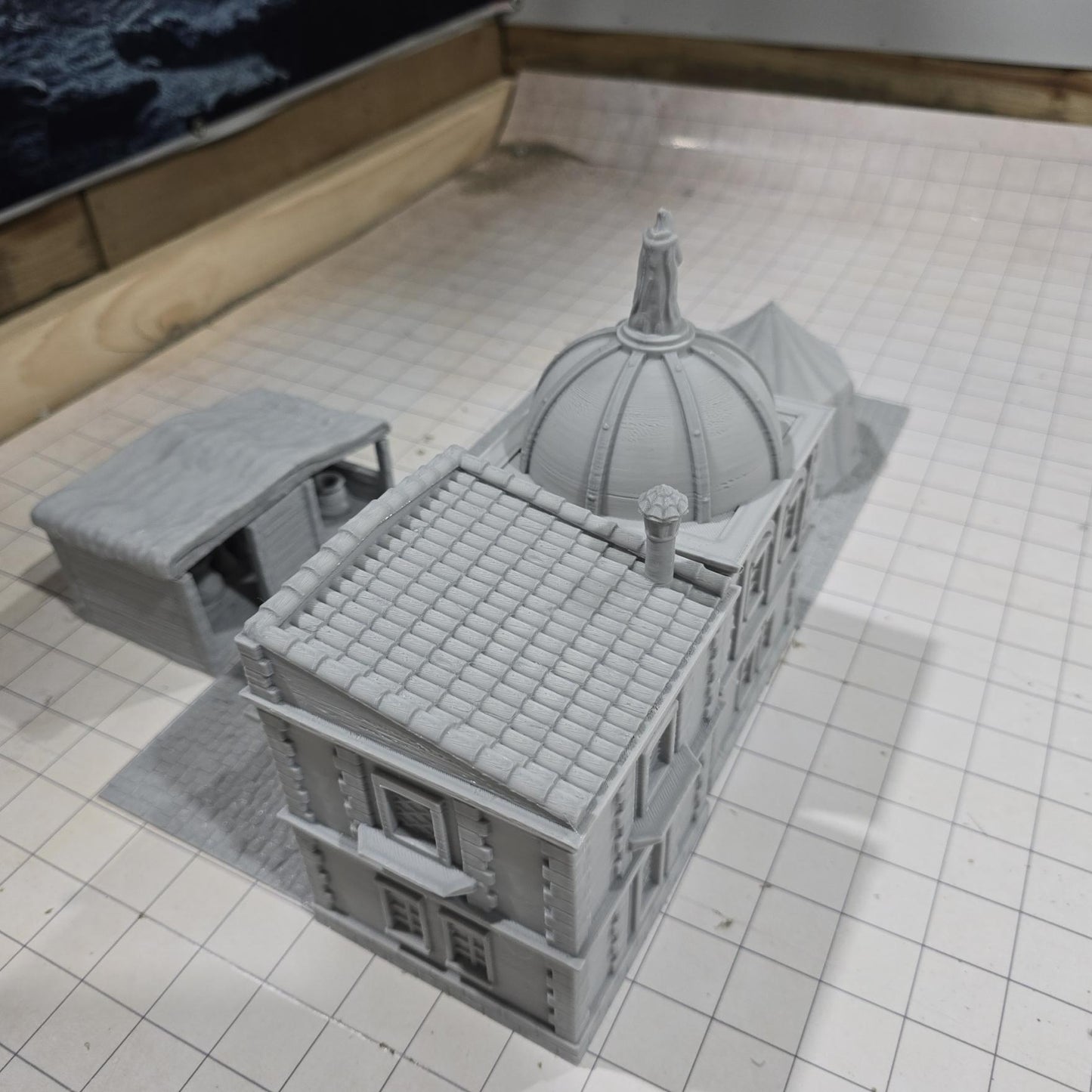 Complete medieval street set with two detailed buildings, a market tent and stall, and five cobblestone roads, perfect for tabletop role-playing games.