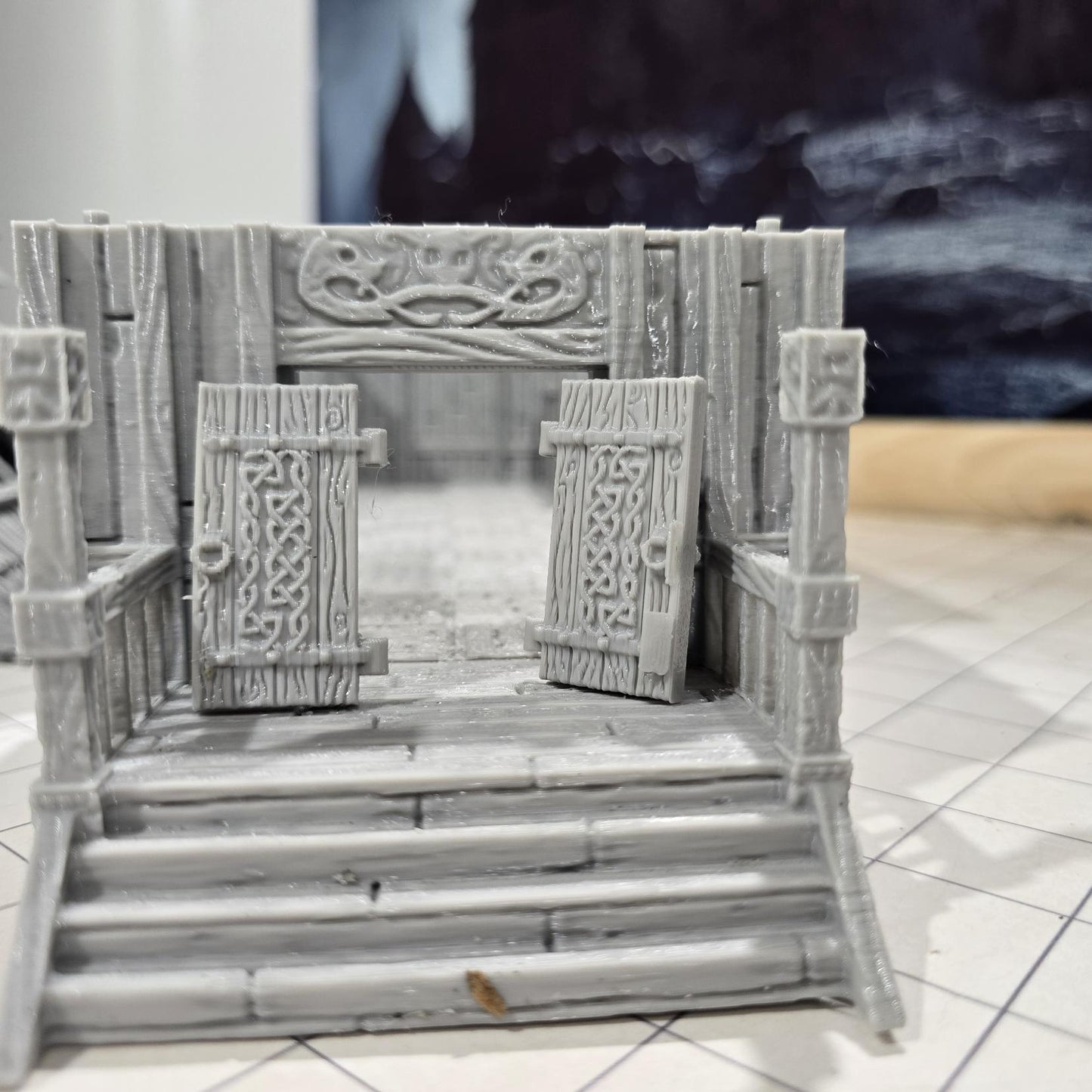 The Viking Era Nordic Longhouse by DarkRealmsForge features traditional Norse carvings and rugged wooden textures, ideal for historical RPGs and reenactment skirmish games.