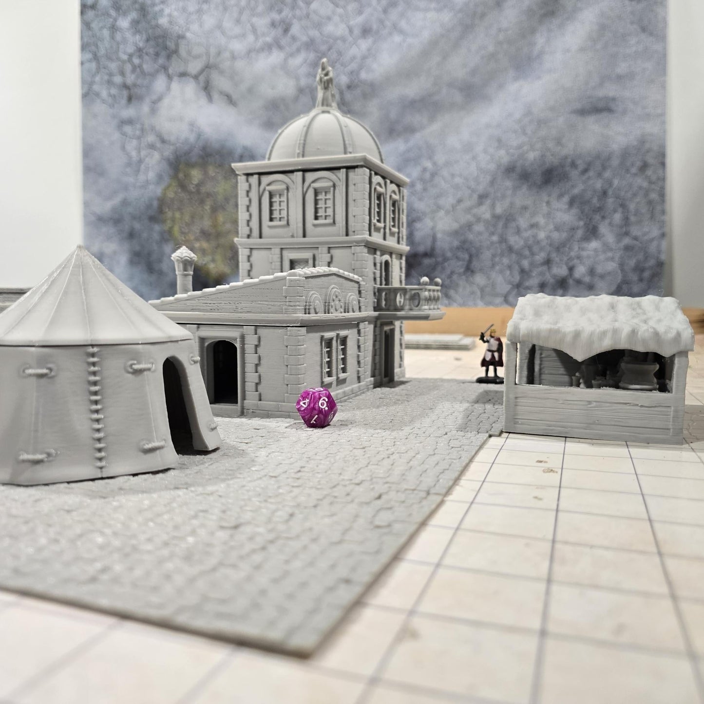 Complete medieval street set with two detailed buildings, a market tent and stall, and five cobblestone roads, perfect for tabletop role-playing games.