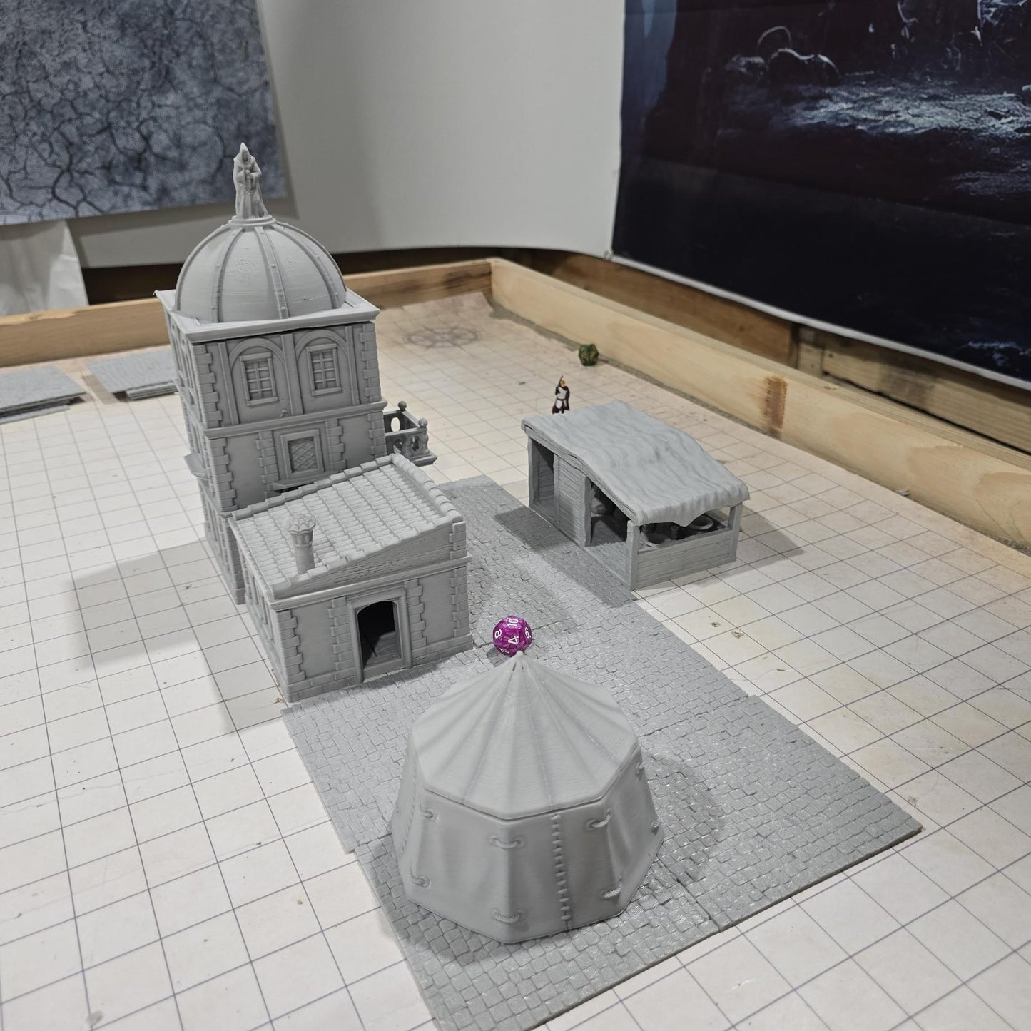 Complete medieval street set with two detailed buildings, a market tent and stall, and five cobblestone roads, perfect for tabletop role-playing games.