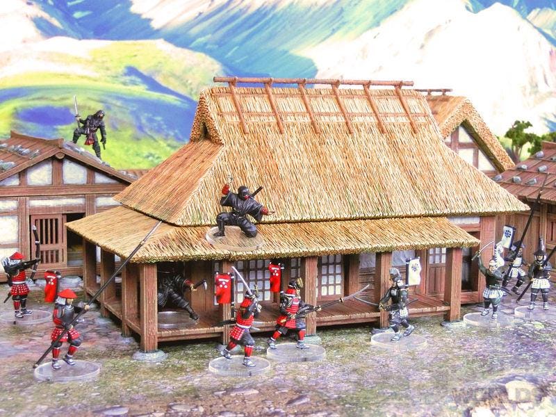 Intricately detailed miniature Samurai Farmhouse set featuring traditional Japanese farmhouses, accessories, and landscape elements.