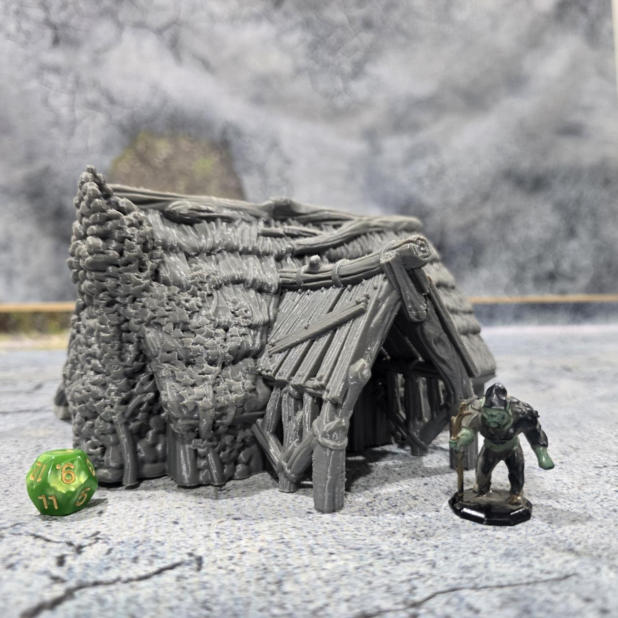 "Explore the life of a Viking with this accurately modeled Common House, featuring a detailed interior and rugged exterior, perfect for historical tabletop games."