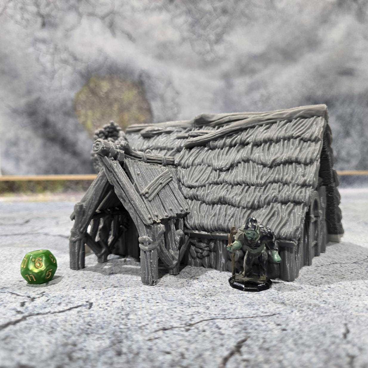 "Explore the life of a Viking with this accurately modeled Common House, featuring a detailed interior and rugged exterior, perfect for historical tabletop games."