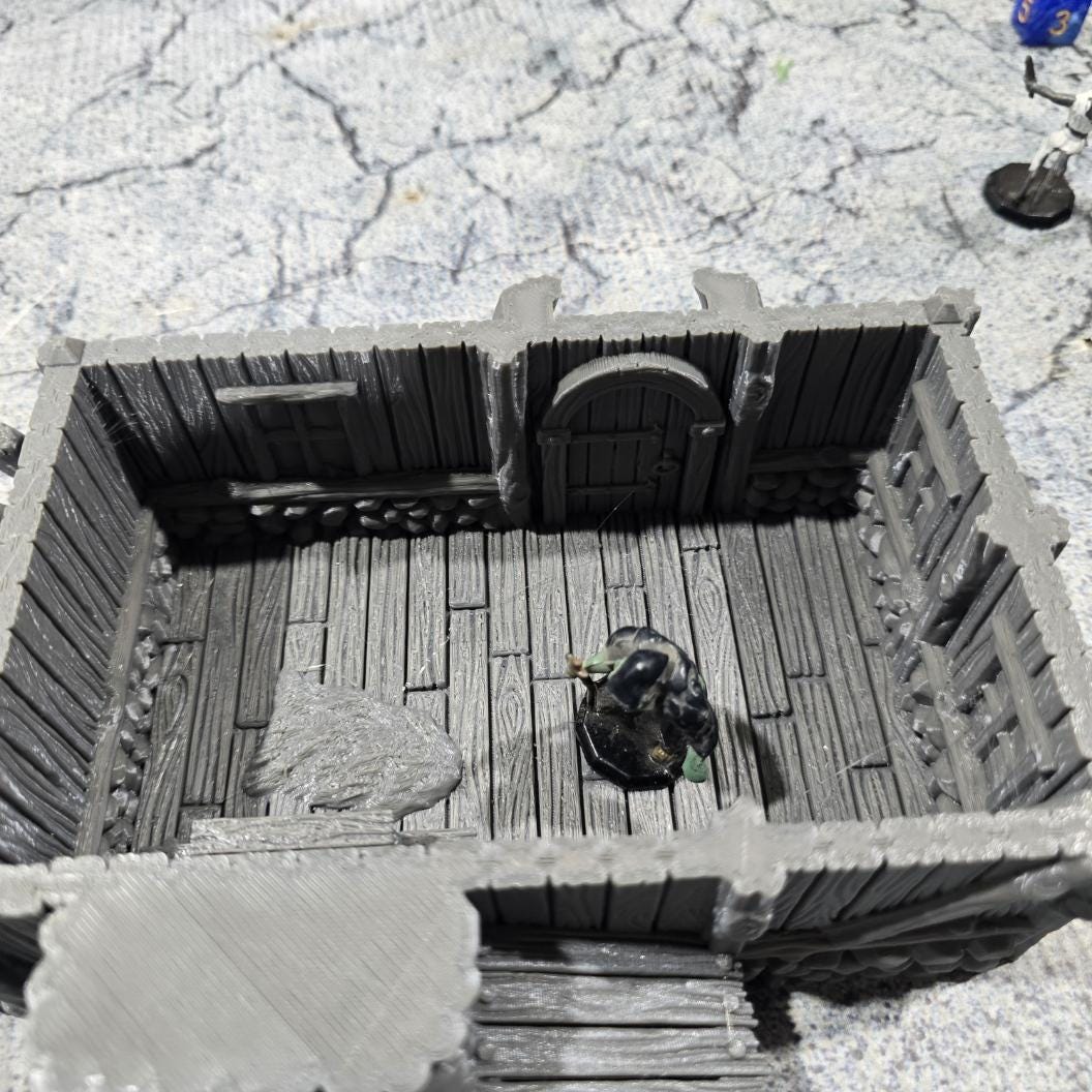 Discover the Achievement Building, Medieval Nordic Lodge, expertly designed for historical and fantasy settings, showcasing fine craftsmanship and an authentic look suitable for various tabletop games.