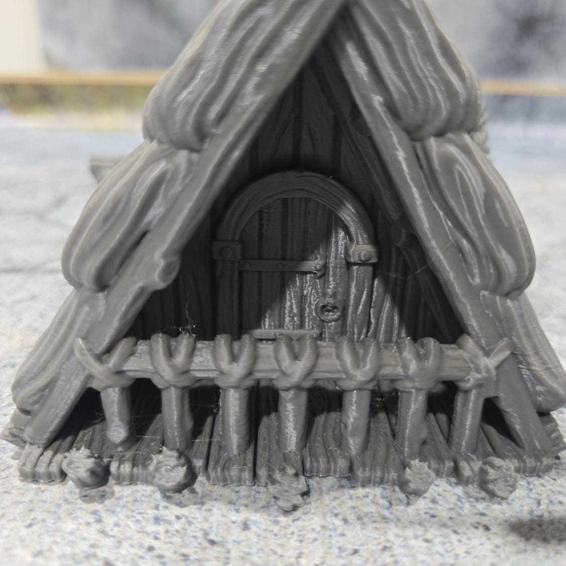 Discover the Achievement Building, Medieval Nordic Lodge, expertly designed for historical and fantasy settings, showcasing fine craftsmanship and an authentic look suitable for various tabletop games.
