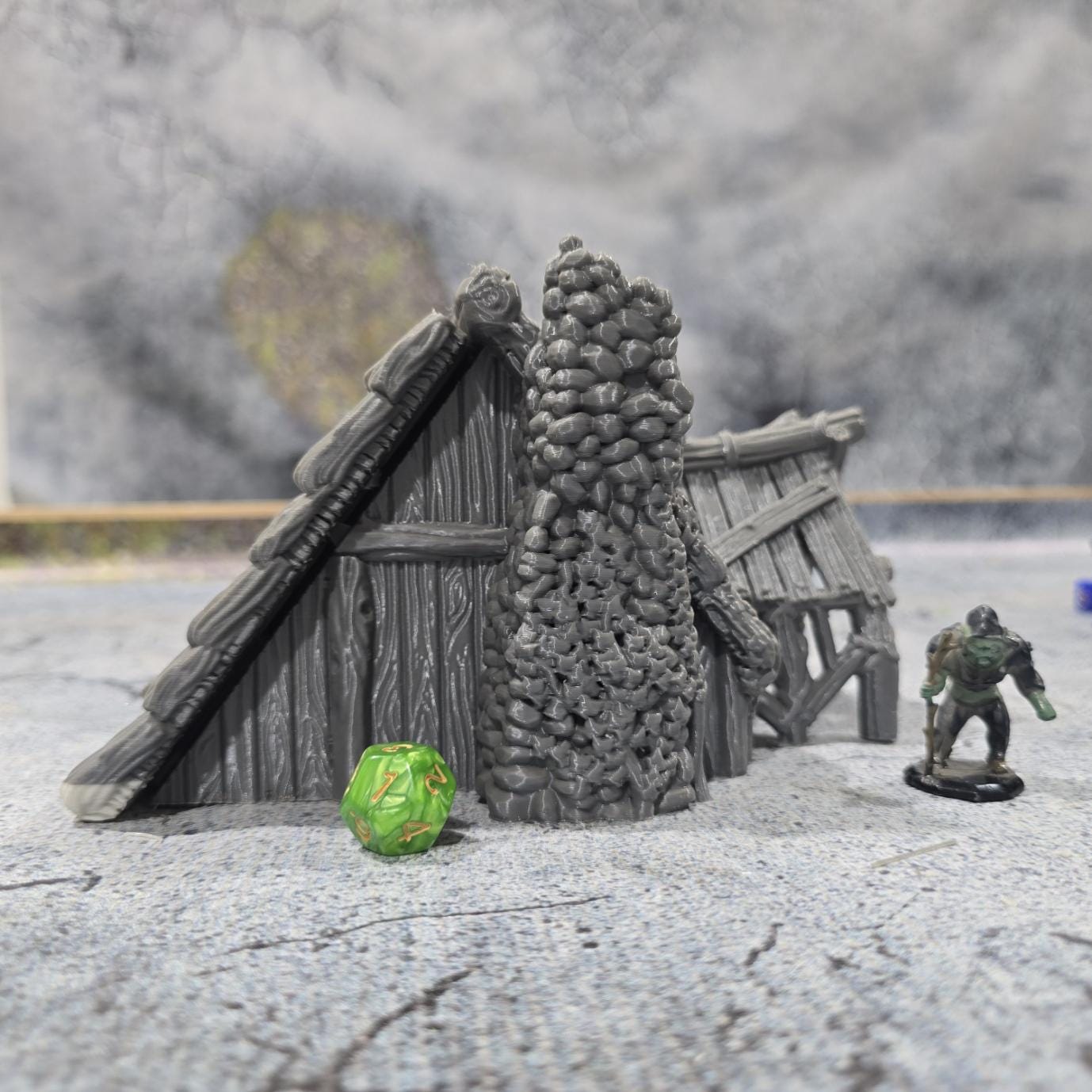 "Explore the life of a Viking with this accurately modeled Common House, featuring a detailed interior and rugged exterior, perfect for historical tabletop games."