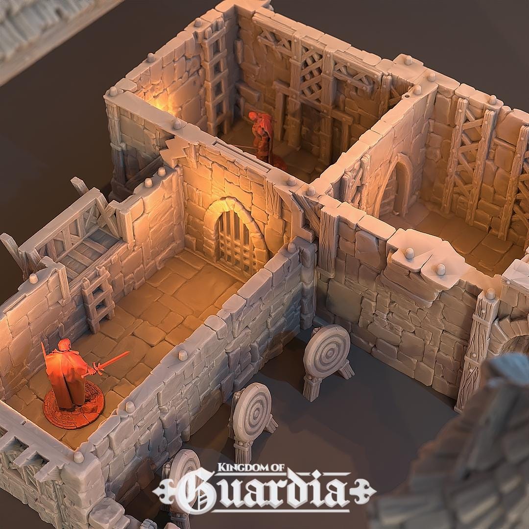 The Archery School – The Butts Compound rises with fortified stone walls, timber bridges, and training yards. The courtyard features archery targets, while towers and walkways provide elevated positions. Lit interiors and removable roofs make it fully playable, perfect for training encounters or dramatic battles.