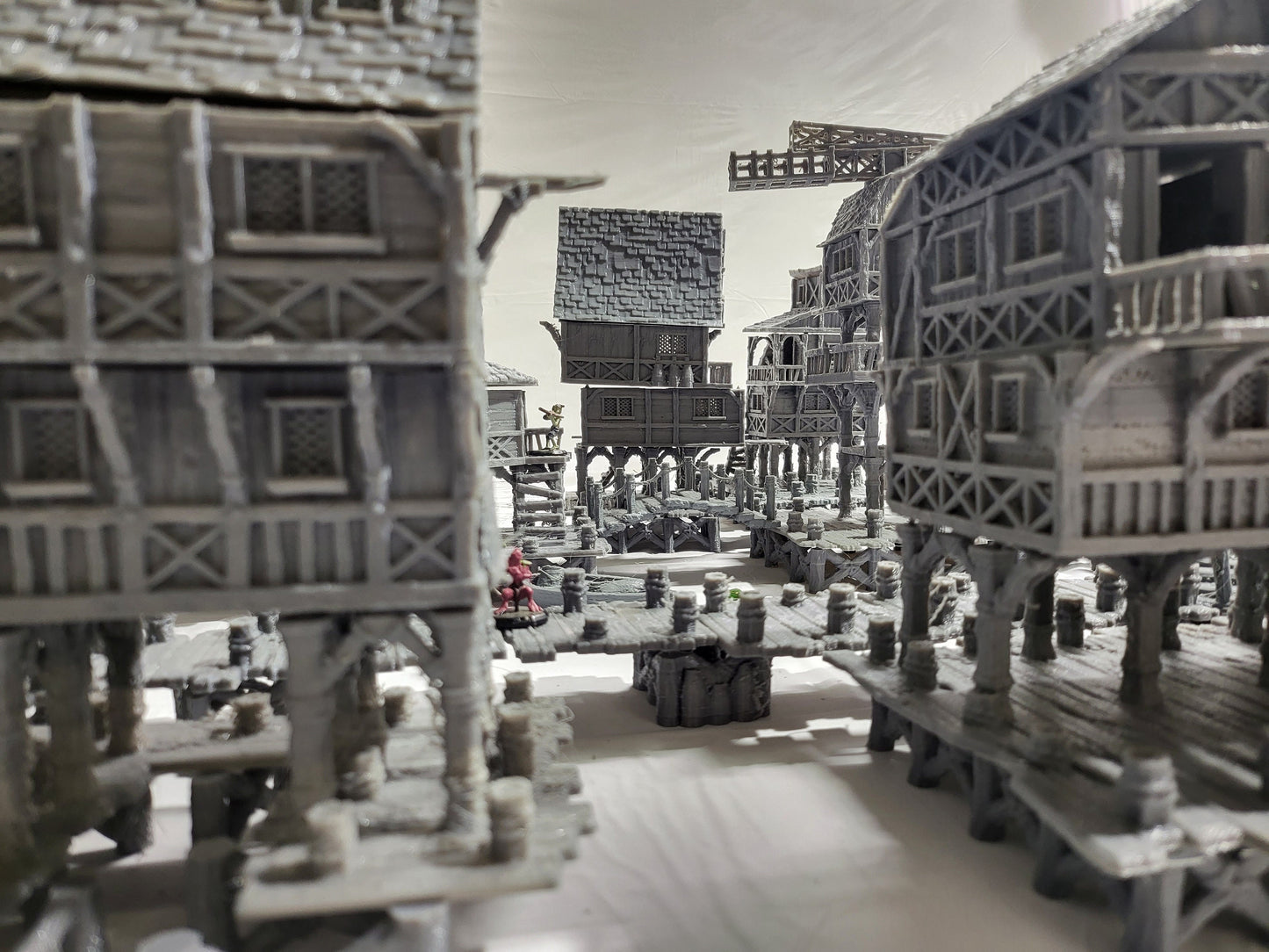 Detailed 28mm Old Lake Town set for tabletop RPGs, featuring six unique buildings with varied architectural styles. Perfect for creating immersive lakeside town scenes in games like D&D and Pathfinder.
