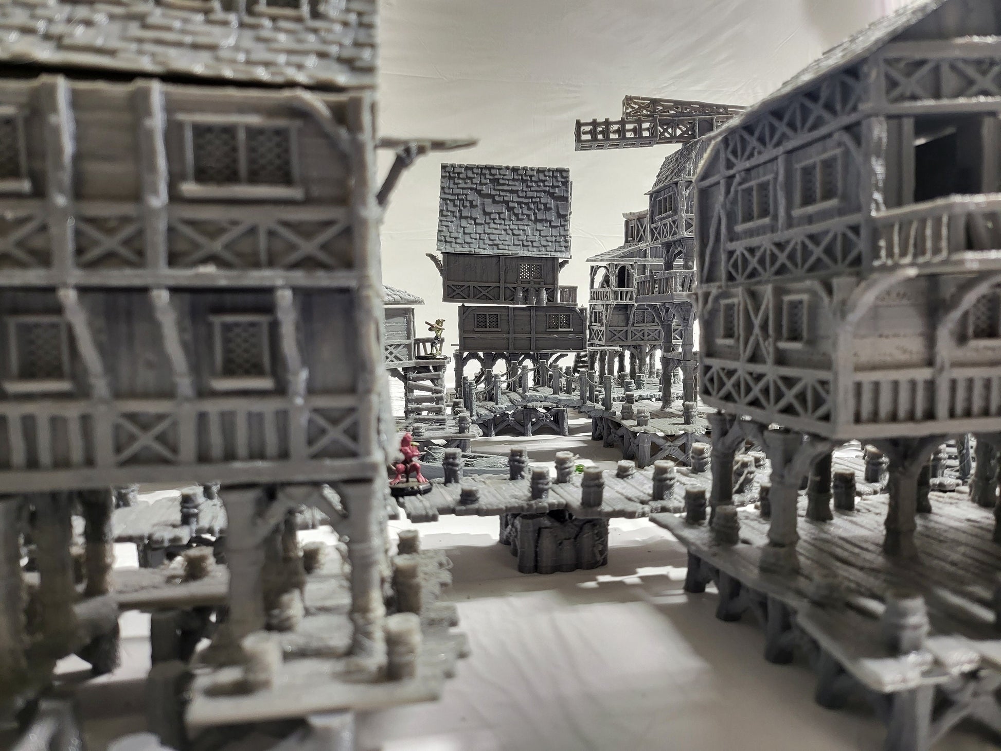Detailed 28mm Old Lake Town set for tabletop RPGs, featuring six unique buildings with varied architectural styles. Perfect for creating immersive lakeside town scenes in games like D&D and Pathfinder.