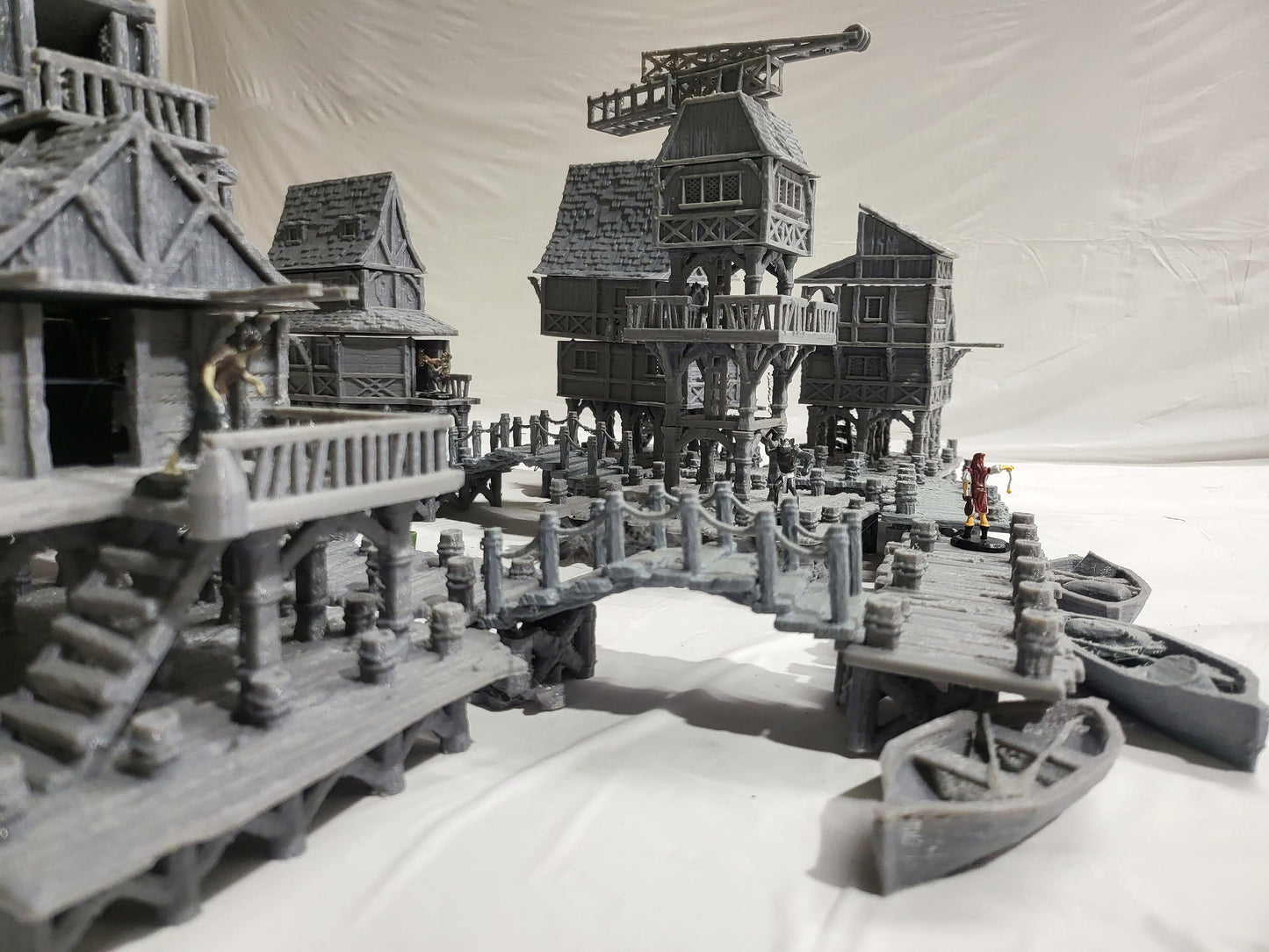 Detailed 28mm Old Lake Town set for tabletop RPGs, featuring six unique buildings with varied architectural styles. Perfect for creating immersive lakeside town scenes in games like D&D and Pathfinder.