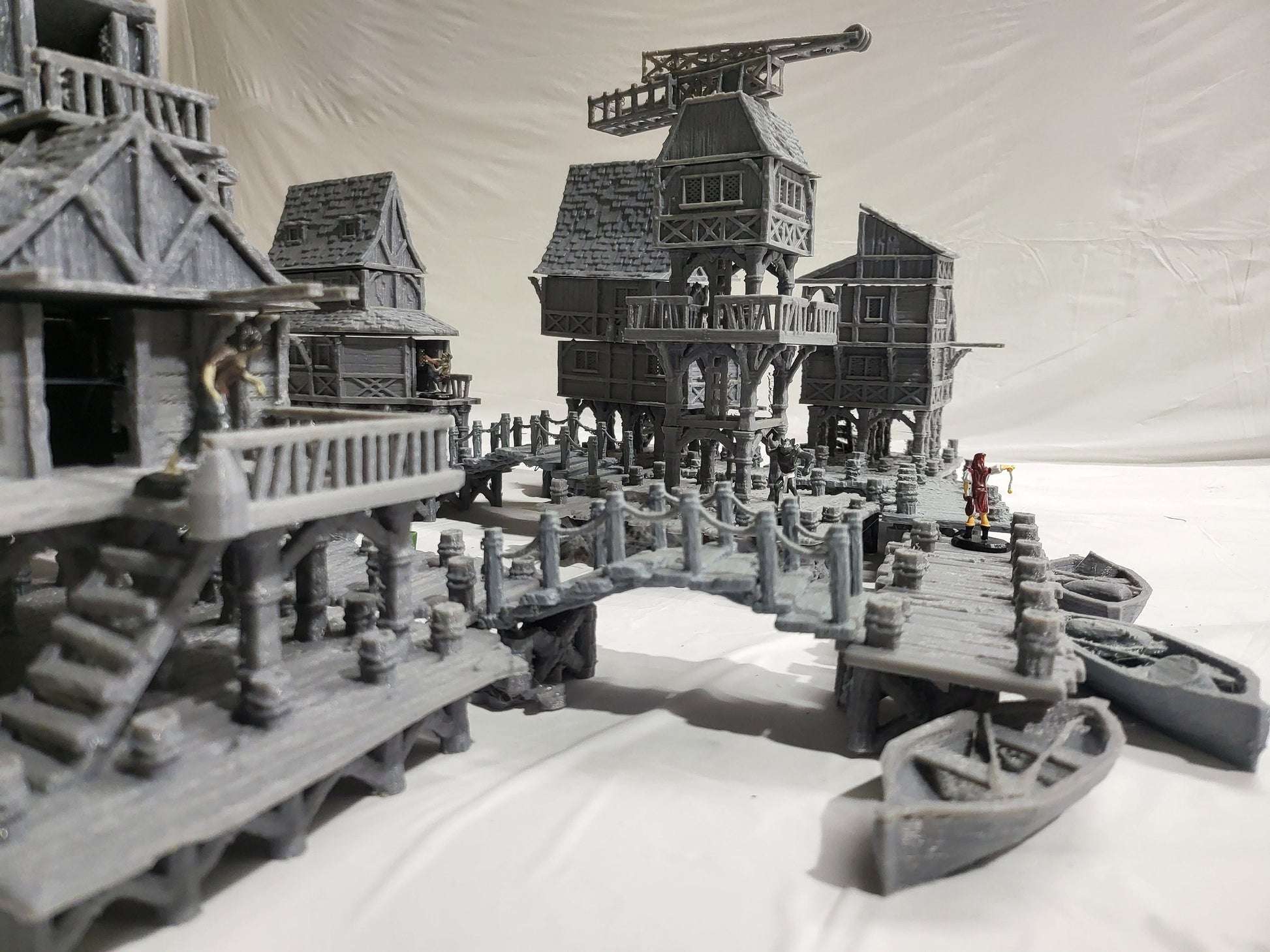 Detailed 28mm Old Lake Town set for tabletop RPGs, featuring six unique buildings with varied architectural styles. Perfect for creating immersive lakeside town scenes in games like D&D and Pathfinder.