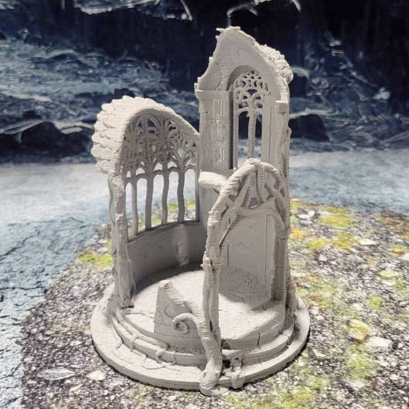 A detailed 3D-printed model of a ruined Elven watchtower for tabletop RPGs like DnD and Pathfinder. Features include intricate stone walls, elegant arches, and remnants of Elven craftsmanship. Perfect for fantasy and historical settings