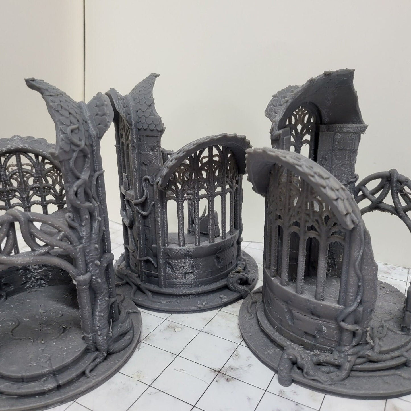 A detailed 3D-printed model of a ruined Elven watchtower for tabletop RPGs like DnD and Pathfinder. Features include intricate stone walls, elegant arches, and remnants of Elven craftsmanship. Perfect for fantasy and historical settings