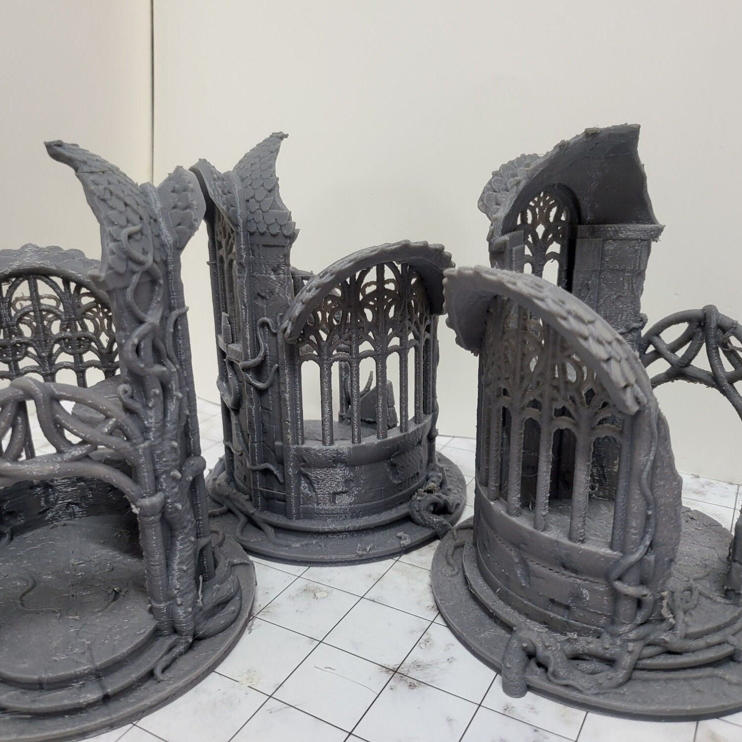 A detailed 3D-printed model of a ruined Elven watchtower for tabletop RPGs like DnD and Pathfinder. Features include intricate stone walls, elegant arches, and remnants of Elven craftsmanship. Perfect for fantasy and historical settings