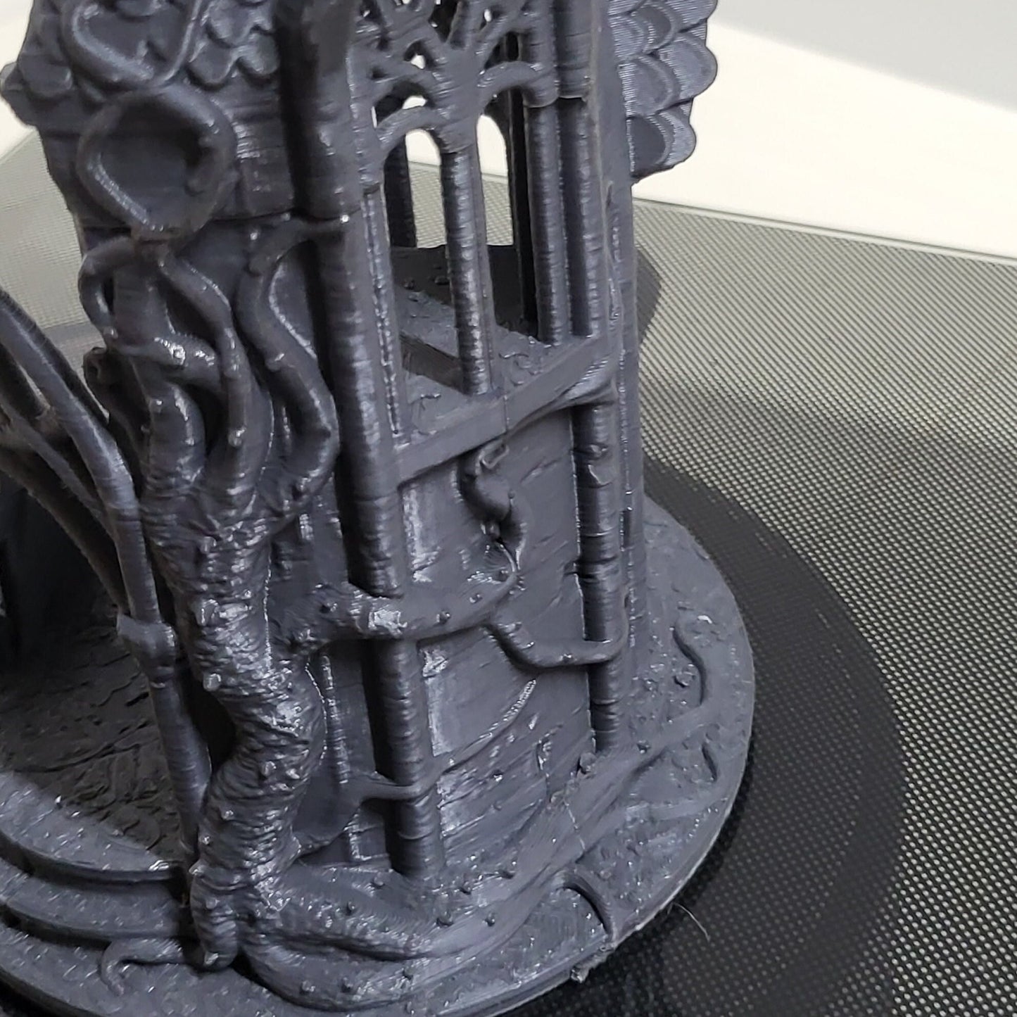 A detailed 3D-printed model of a ruined Elven watchtower for tabletop RPGs like DnD and Pathfinder. Features include intricate stone walls, elegant arches, and remnants of Elven craftsmanship. Perfect for fantasy and historical settings