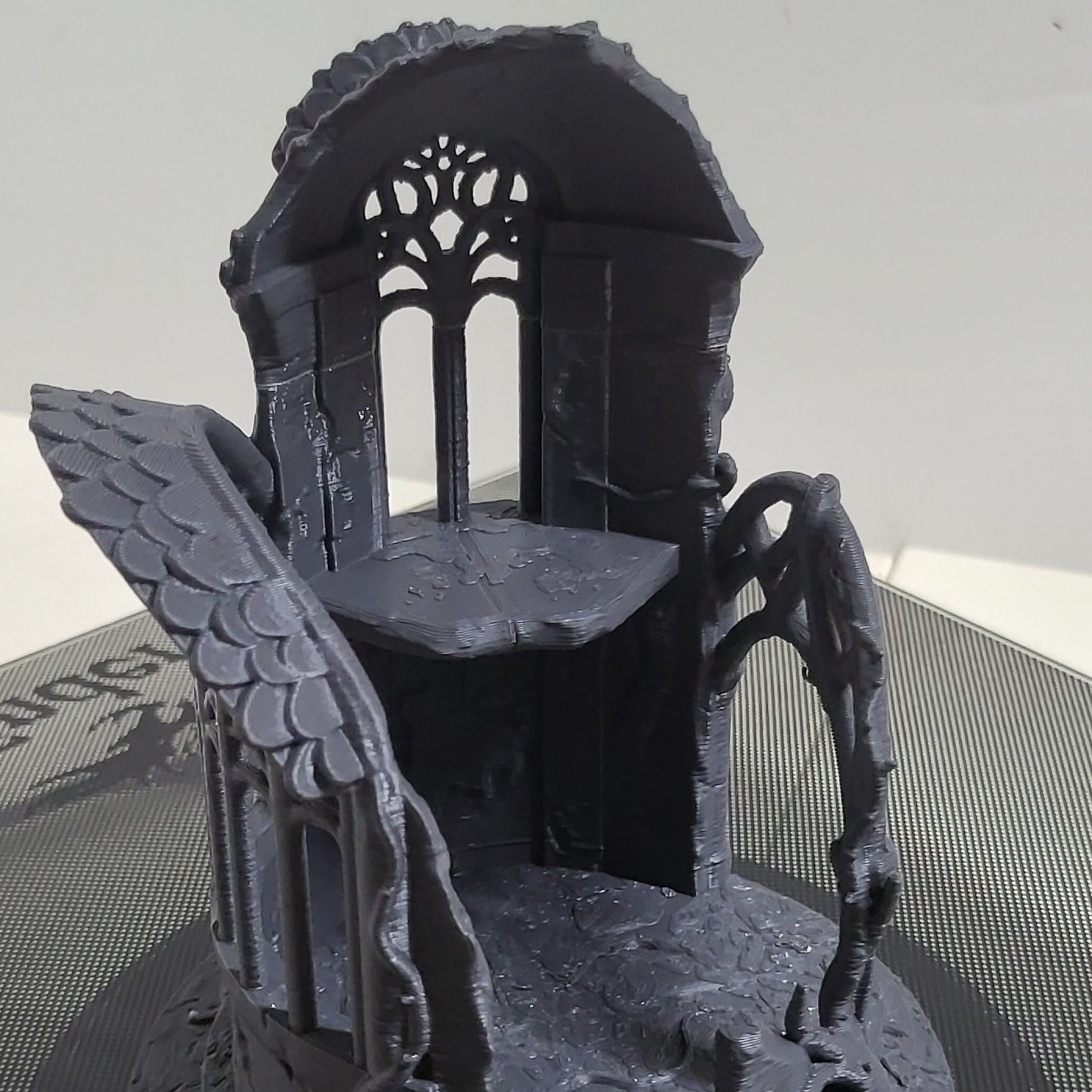 A detailed 3D-printed model of a ruined Elven watchtower for tabletop RPGs like DnD and Pathfinder. Features include intricate stone walls, elegant arches, and remnants of Elven craftsmanship. Perfect for fantasy and historical settings