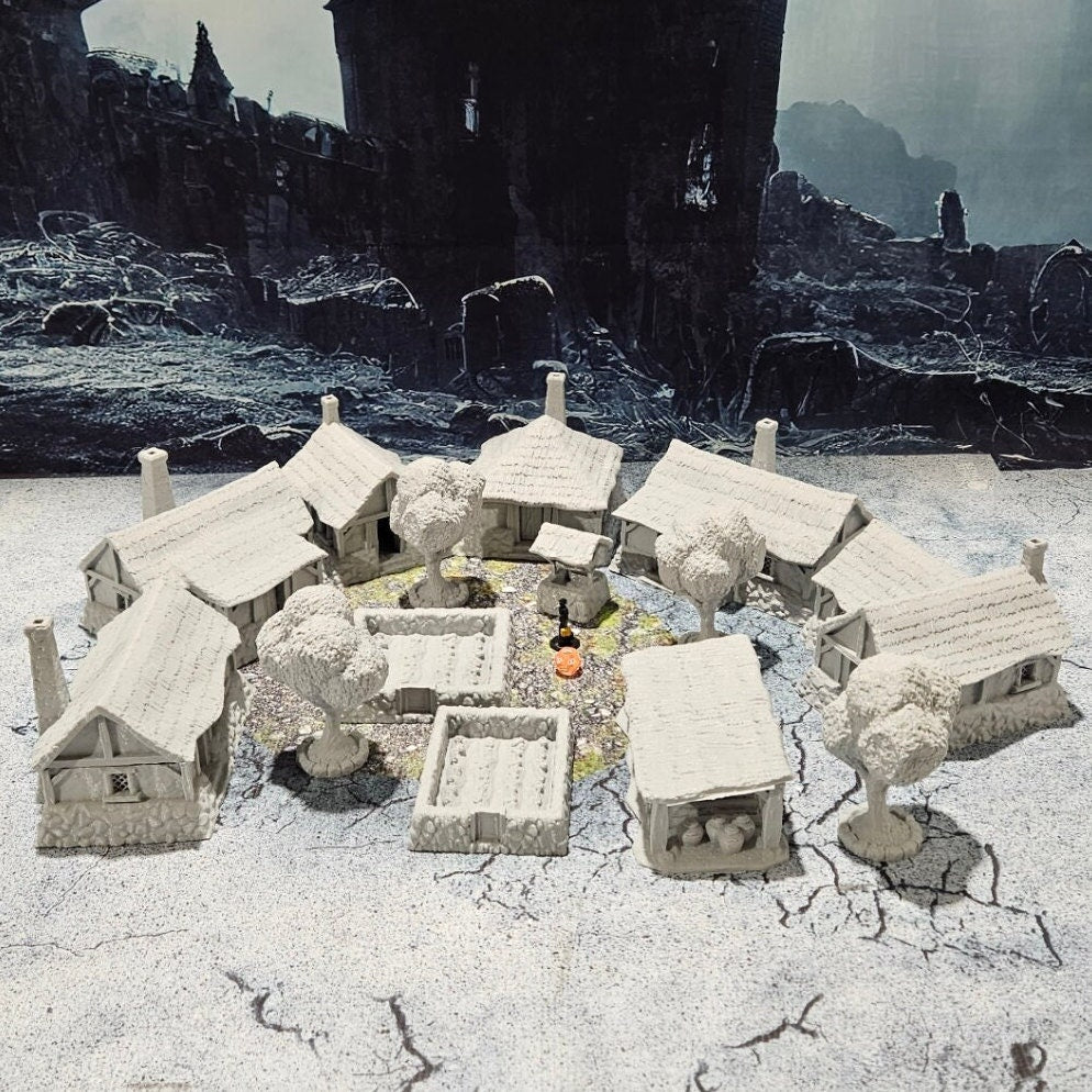 Detailed 28mm simple village set for tabletop RPGs, featuring various farm buildings and rustic structures with intricate designs. Perfect for creating immersive rural village scenes in games like D&D and Pathfinder.