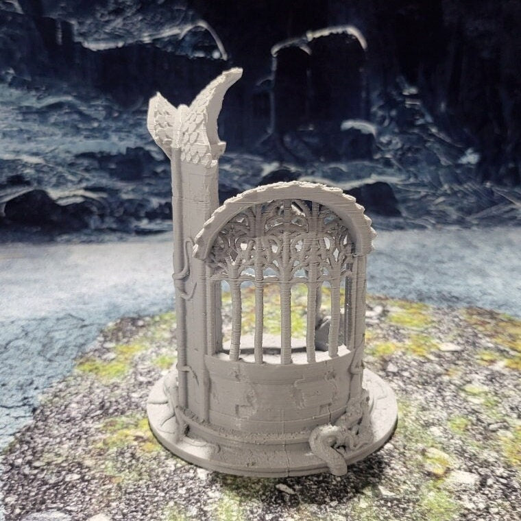 A detailed 3D-printed model of a ruined Elven watchtower for tabletop RPGs like DnD and Pathfinder. Features include intricate stone walls, elegant arches, and remnants of Elven craftsmanship. Perfect for fantasy and historical settings