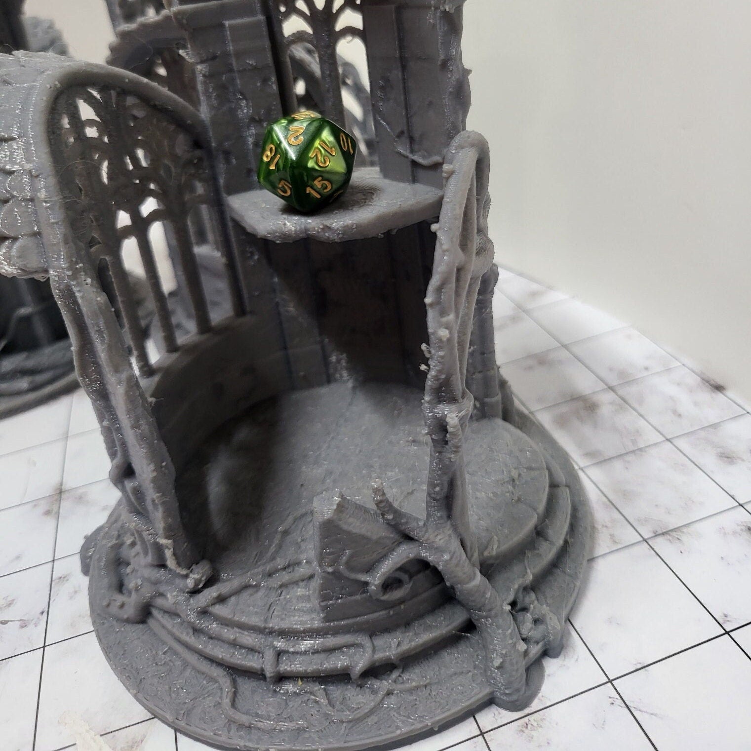 A detailed 3D-printed model of a ruined Elven watchtower for tabletop RPGs like DnD and Pathfinder. Features include intricate stone walls, elegant arches, and remnants of Elven craftsmanship. Perfect for fantasy and historical settings