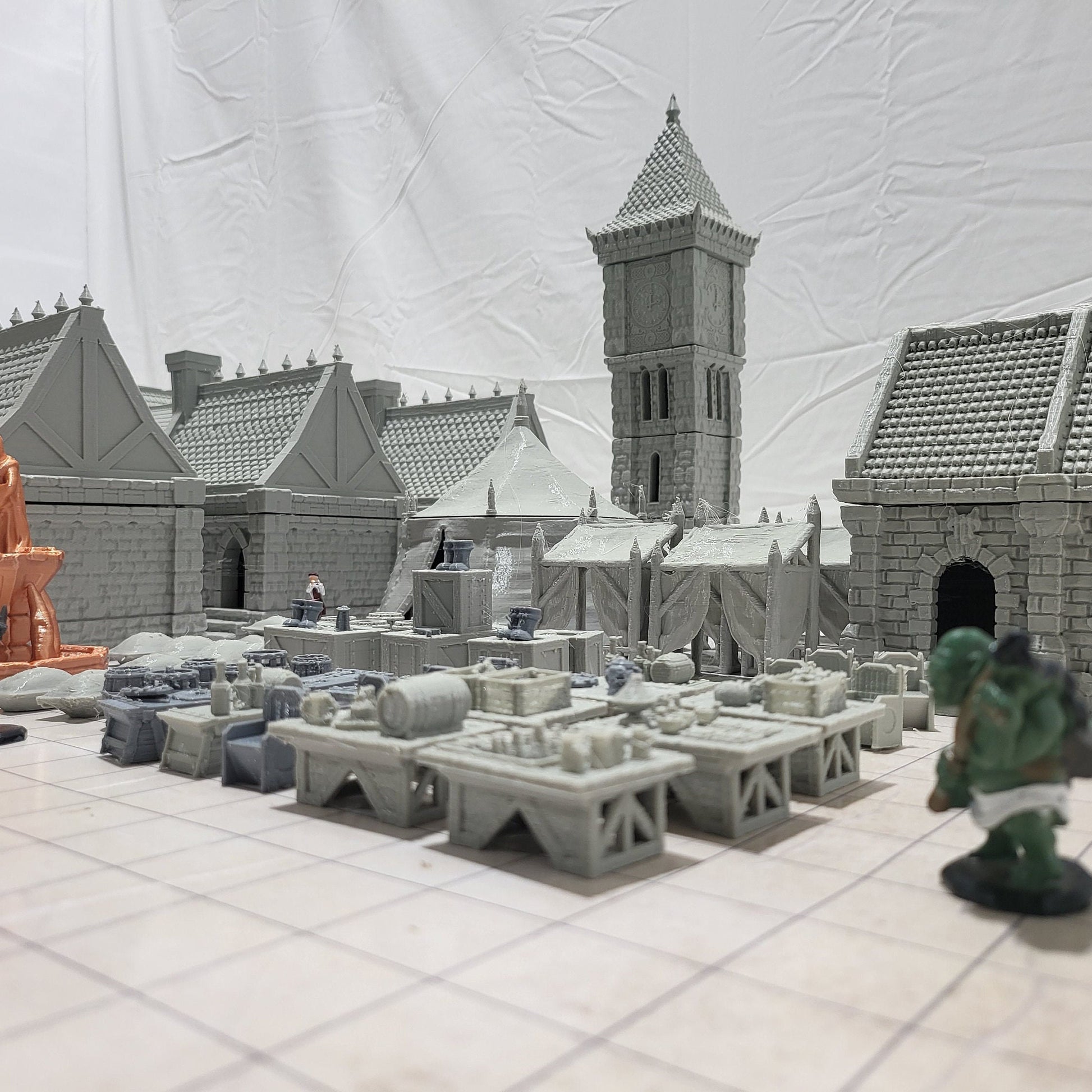9 houses, 1 markettent, 1 clocktower, 6 market stalls, a fountain, and a street market. With everything you need in one shot, this will provide hours of fun for hobbyists & gamers. Get your hands on this fantastic set and bring your tabletop to life!