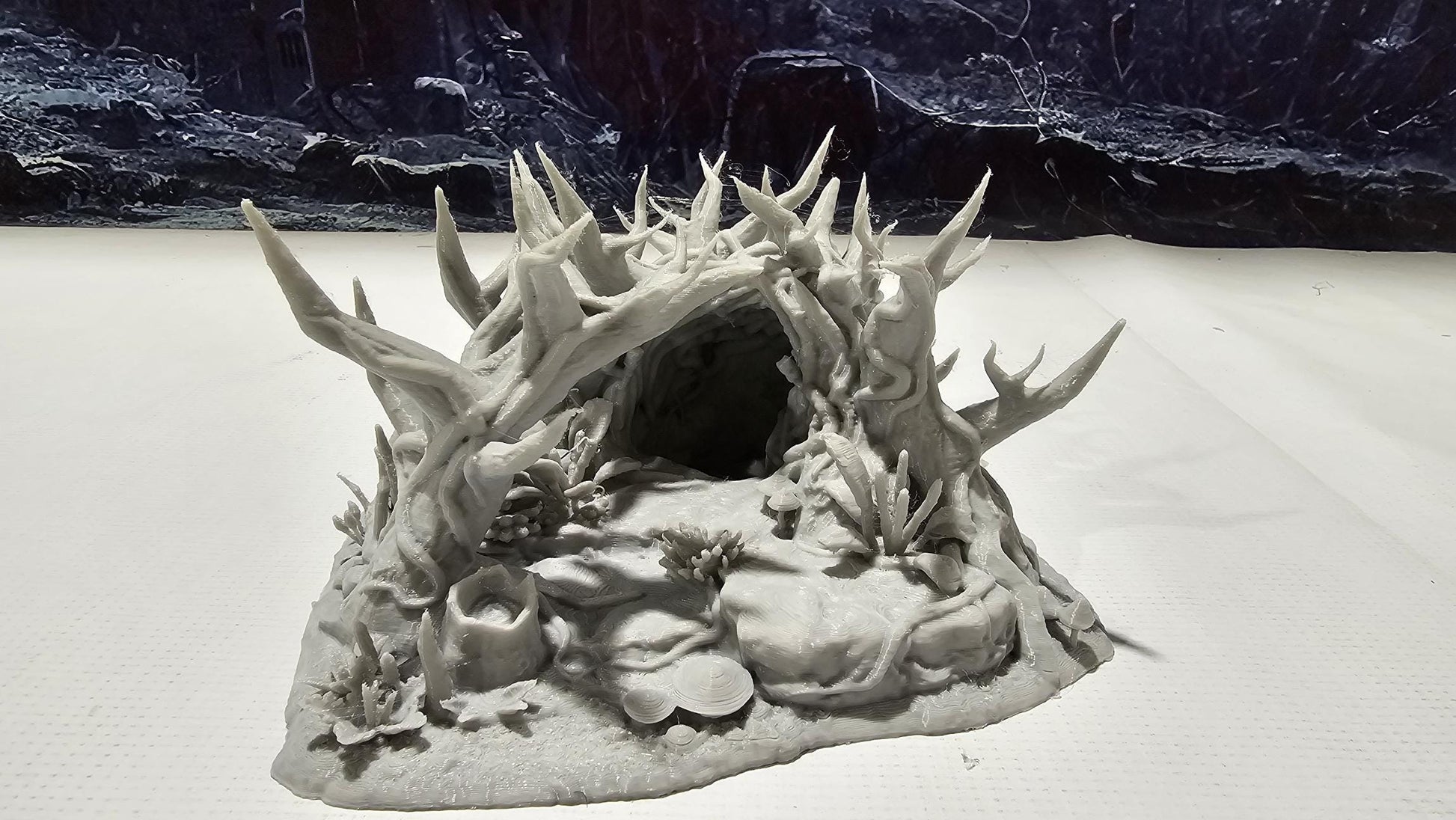 Forest Underground Entrance for tabletop wargaming featuring a hidden cavern entrance with detailed foliage and rock formations. Ideal for forest adventures and dungeon crawls in Warhammer, D&D, Pathfinder, and fantasy-themed games.