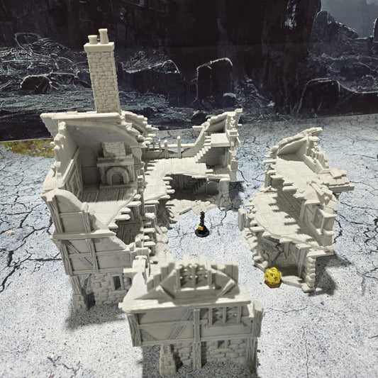 The Barrenfall Manor Ruins model features detailed remains of a medieval manor, complete with collapsed staircases, crumbling stone walls, and debris-filled rooms, perfect for creating an immersive, desolate atmosphere on your tabletop.