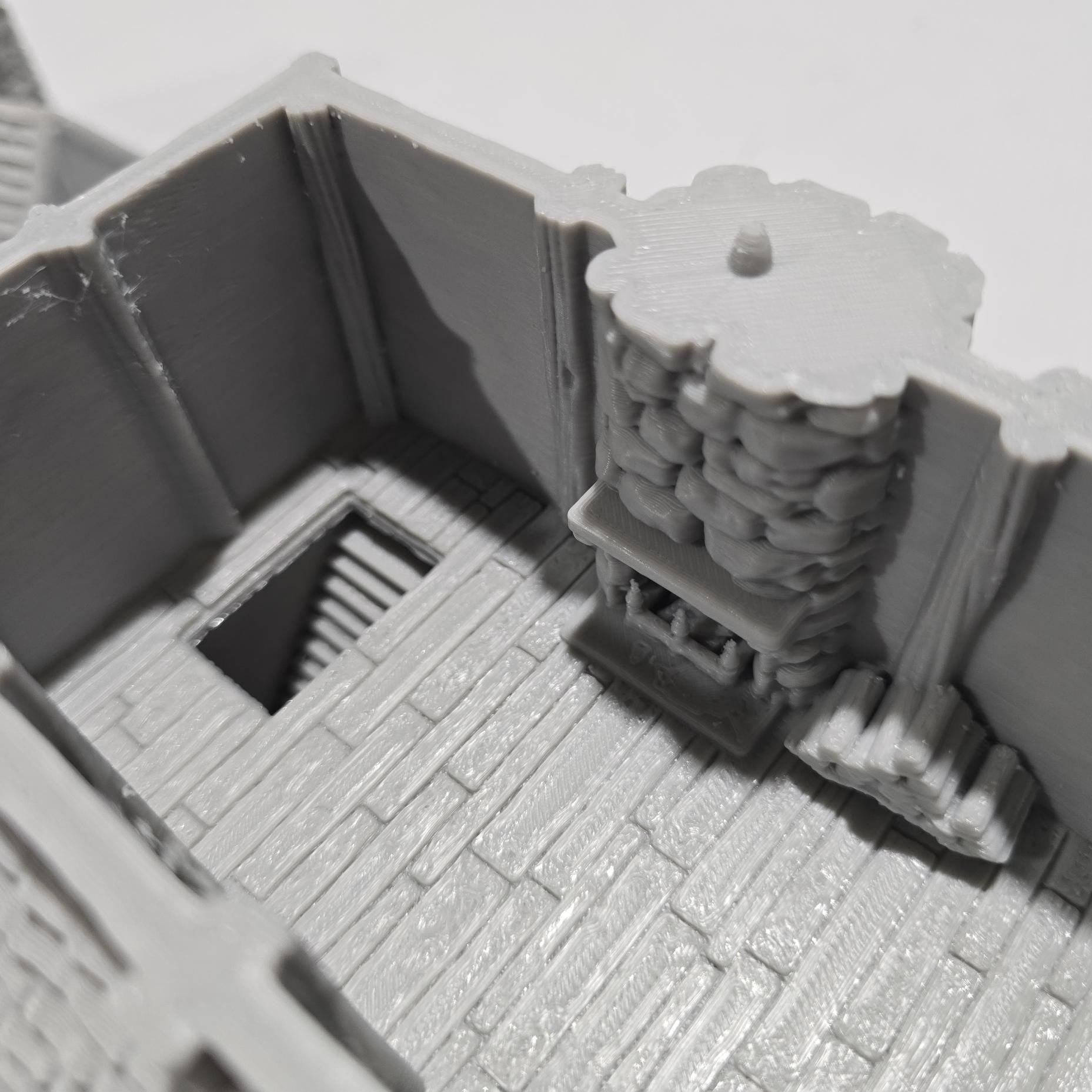 Briarwood House 5 model is a highly detailed medieval half-timbered house, showcasing a classic stone & timber structure. The design includes a steeply pitched roof, a stone chimney, & lattice windows, perfect for enhancing medieval tabletop games