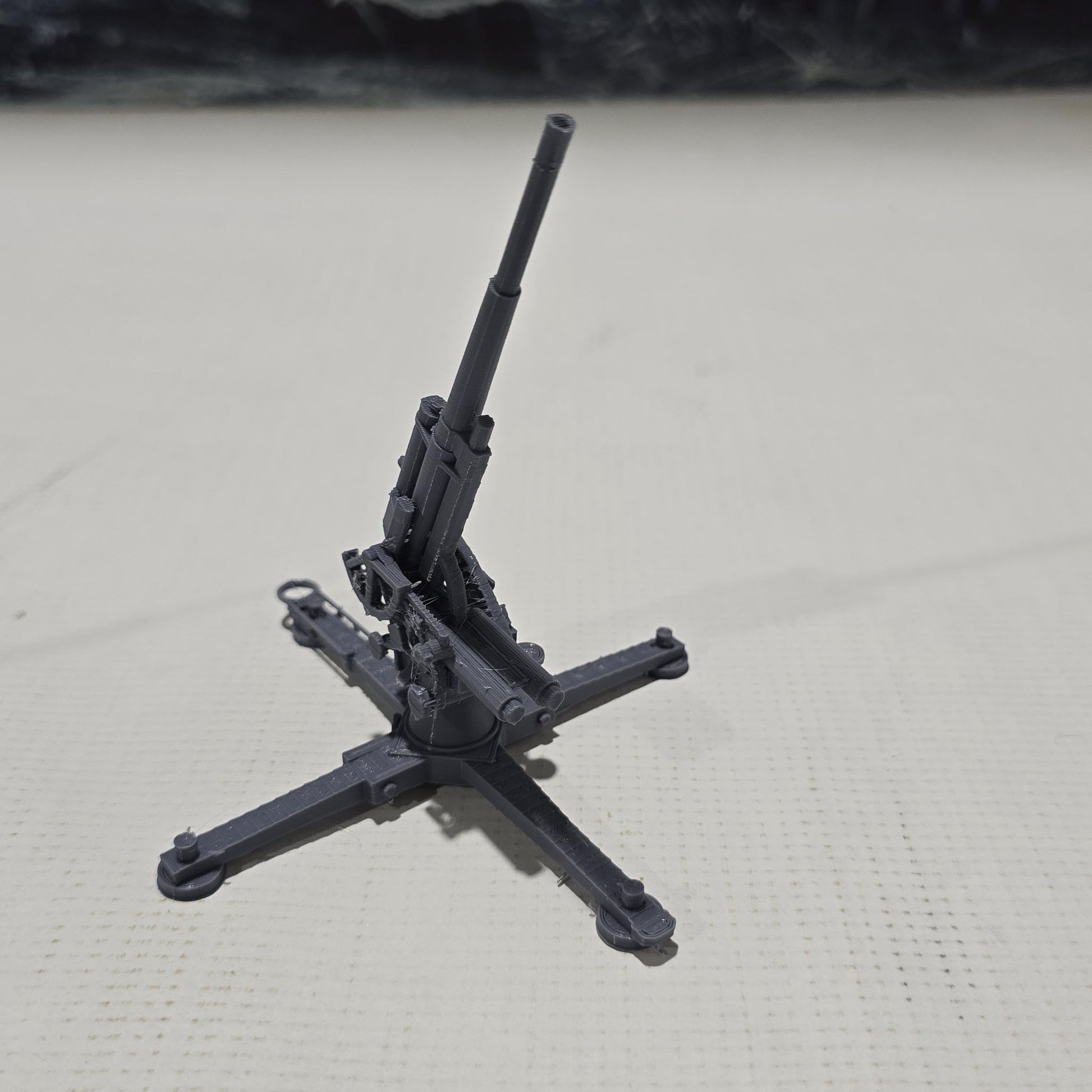 Detailed 3D-printed model of the WWII German Flak 18 heavy flak cannon, showcasing its rotating gun and adjustable barrel, perfect for enhancing your historical and fantasy tabletop gaming sessions.