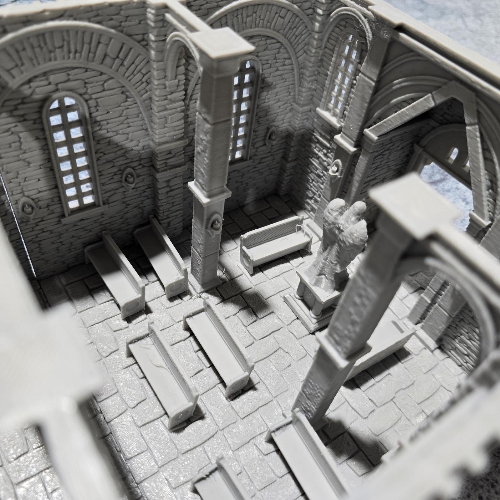 The Greendale Church of the Dale features a medieval gothic design with two angel statues and sets of pews, ideal for historical tabletop settings.