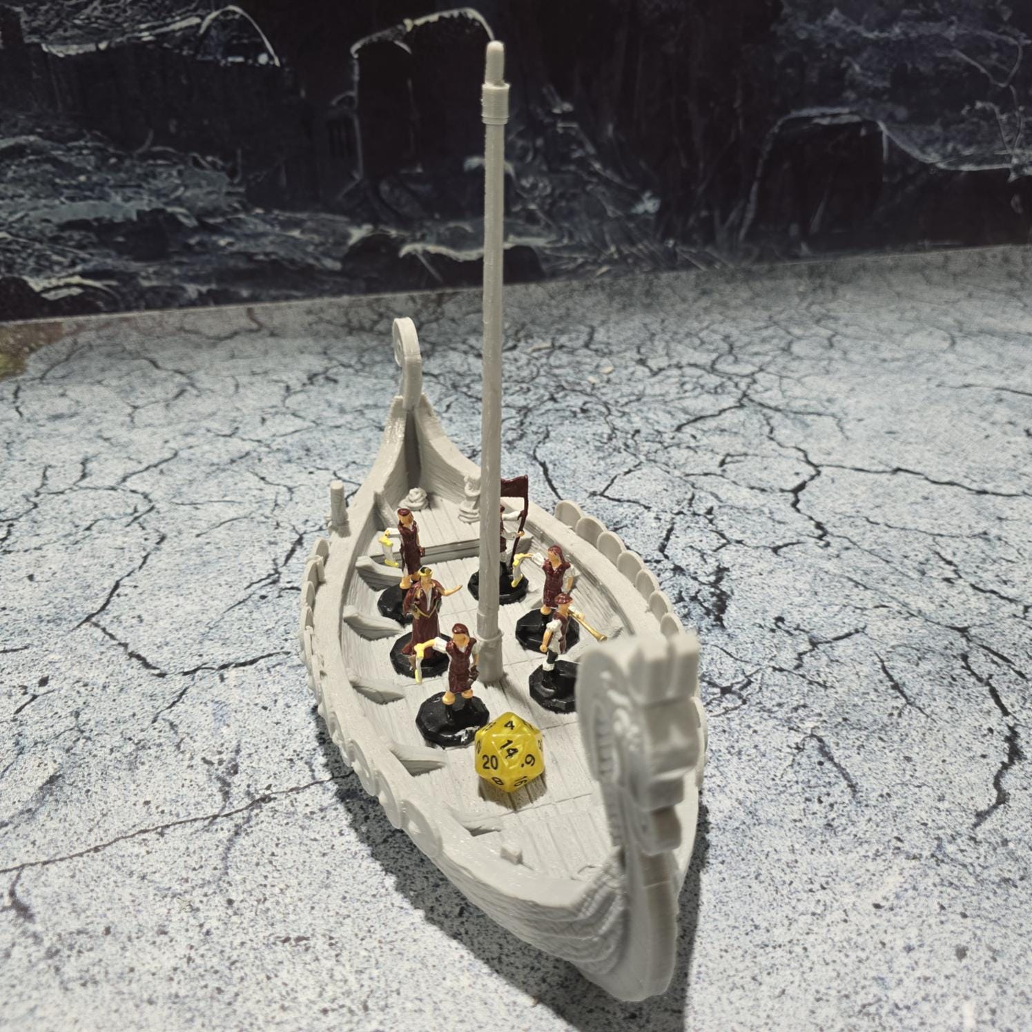 The Viking Invader Ship model features a detailed dragon-head prow, shield-lined sides, and a furled sail, capturing the essence of Norse seafaring prowess, perfect for bringing epic Viking adventures to life on your tabletop.