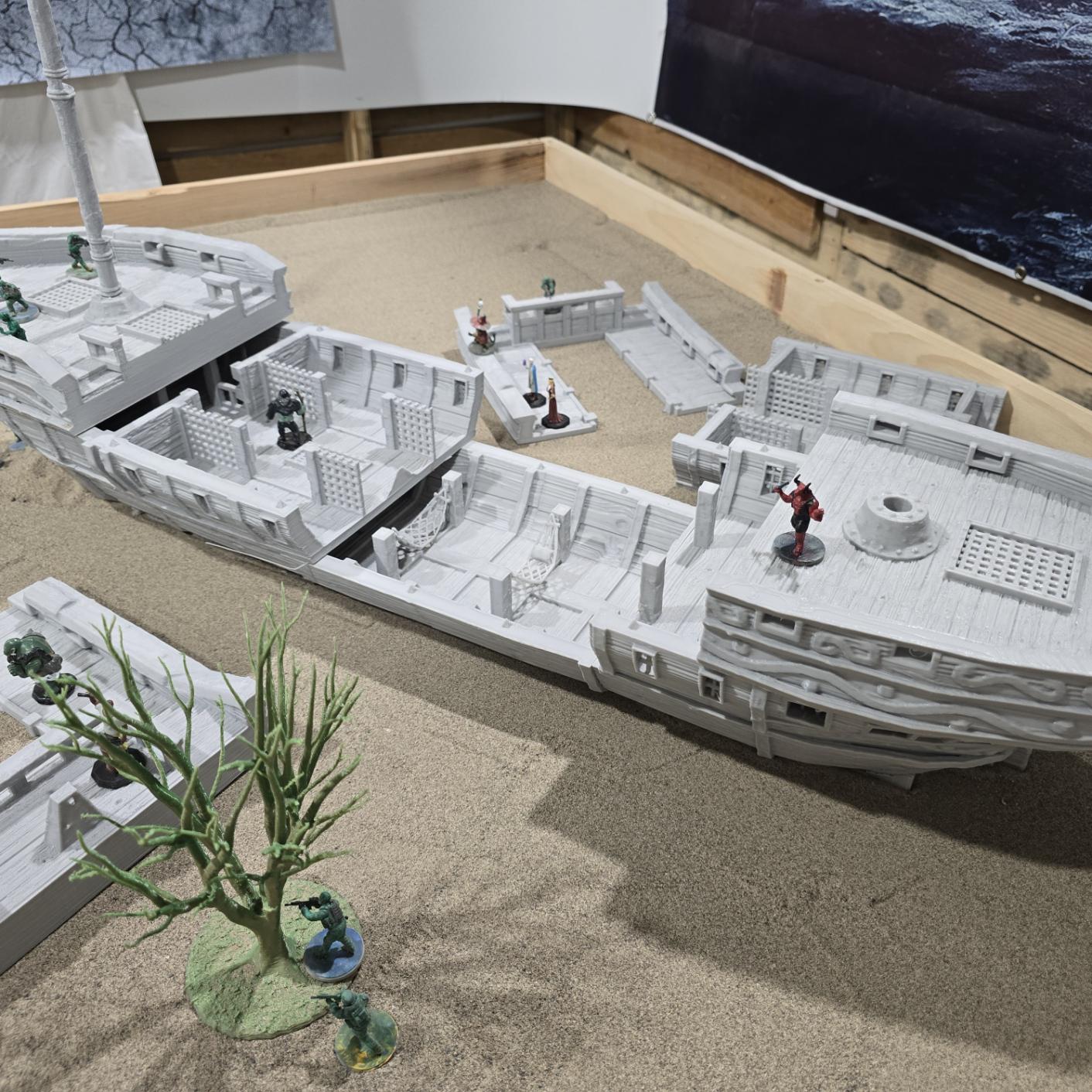 A detailed pirate slave ship model featuring three masts with skull and crossbones sails, wooden textures, and multiple playable levels, including a mid-deck with slave cells, perfect for historical and fantasy tabletop games.