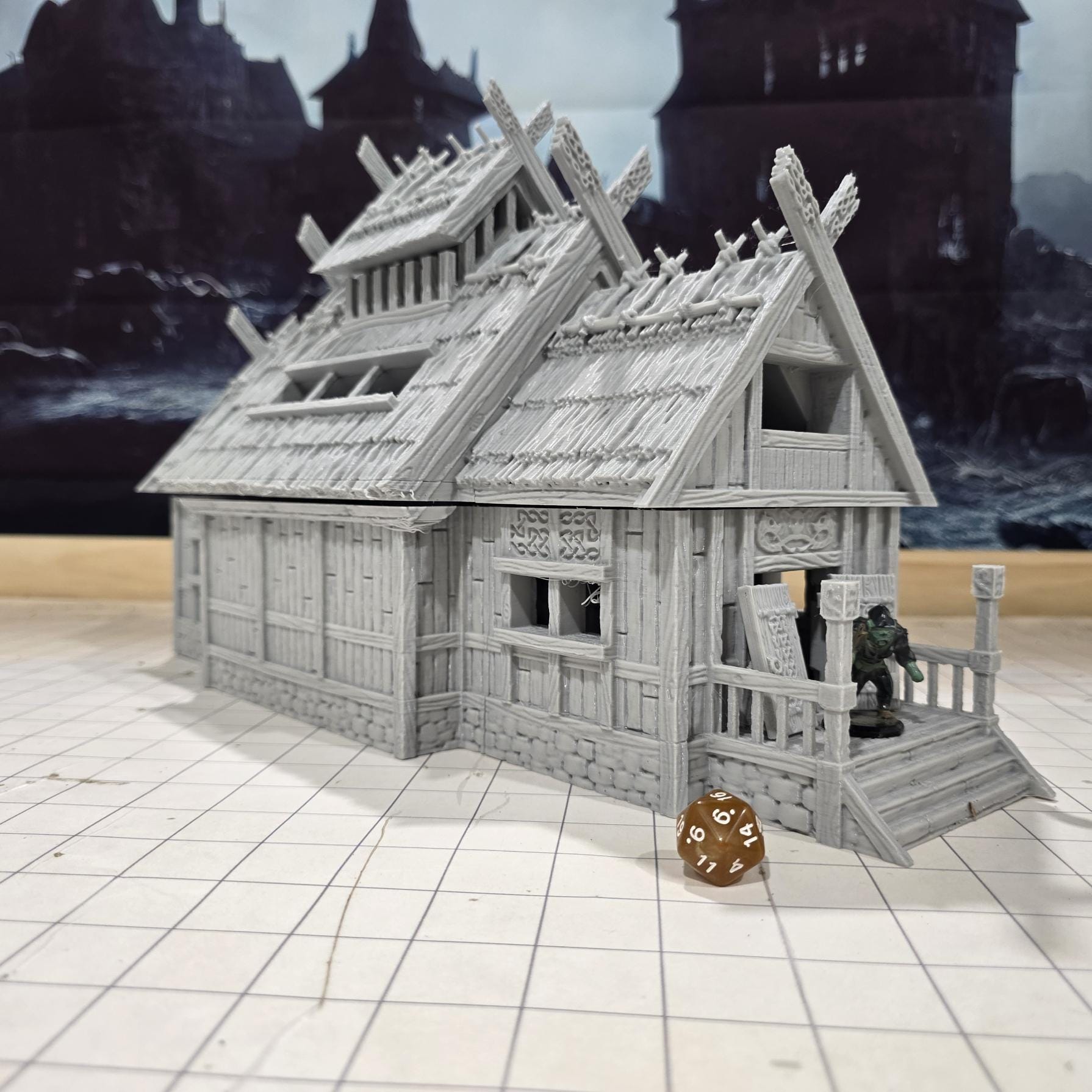 The Viking Era Nordic Longhouse by DarkRealmsForge features traditional Norse carvings and rugged wooden textures, ideal for historical RPGs and reenactment skirmish games.