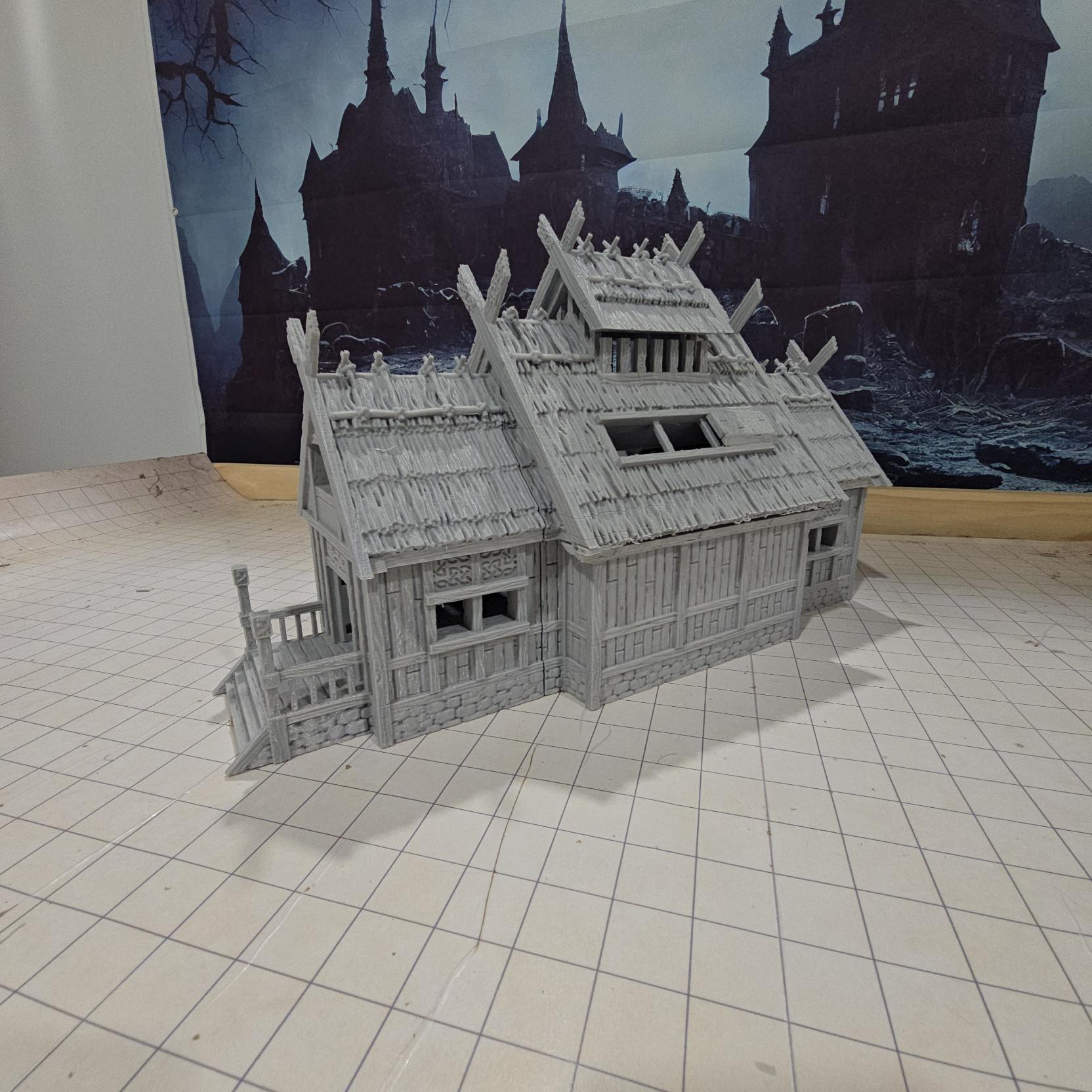 The Viking Era Nordic Longhouse by DarkRealmsForge features traditional Norse carvings and rugged wooden textures, ideal for historical RPGs and reenactment skirmish games.
