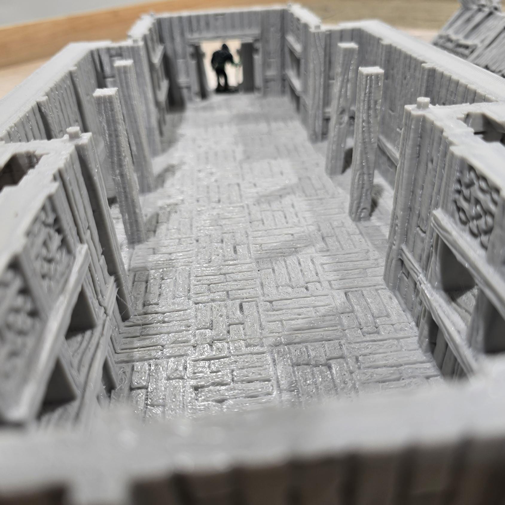 The Viking Era Nordic Longhouse by DarkRealmsForge features traditional Norse carvings and rugged wooden textures, ideal for historical RPGs and reenactment skirmish games.