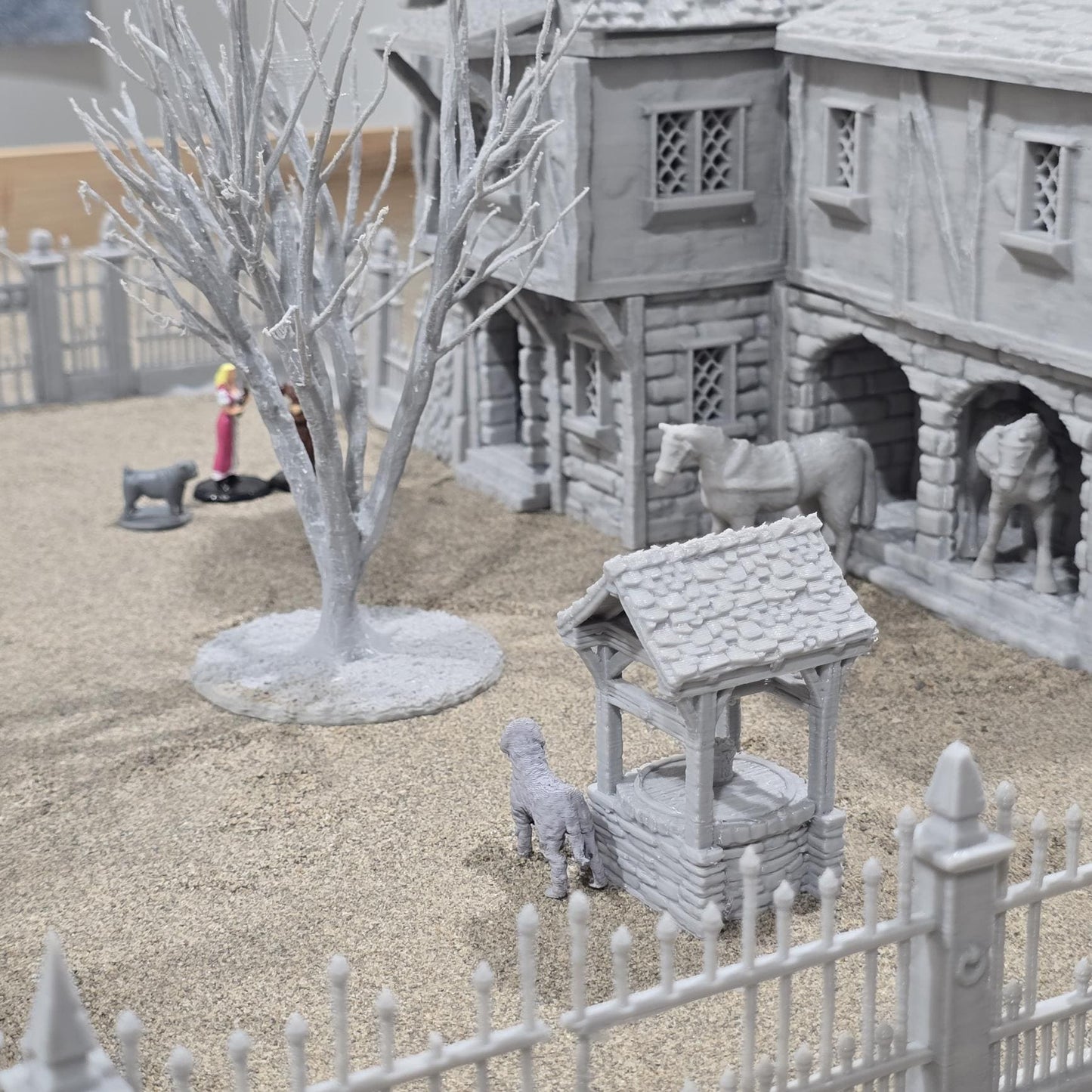 Exquisite 3D printed homestead model with detailed house, fencing, and barren trees, set against a rugged backdrop, perfect for tabletop games and dioramas.