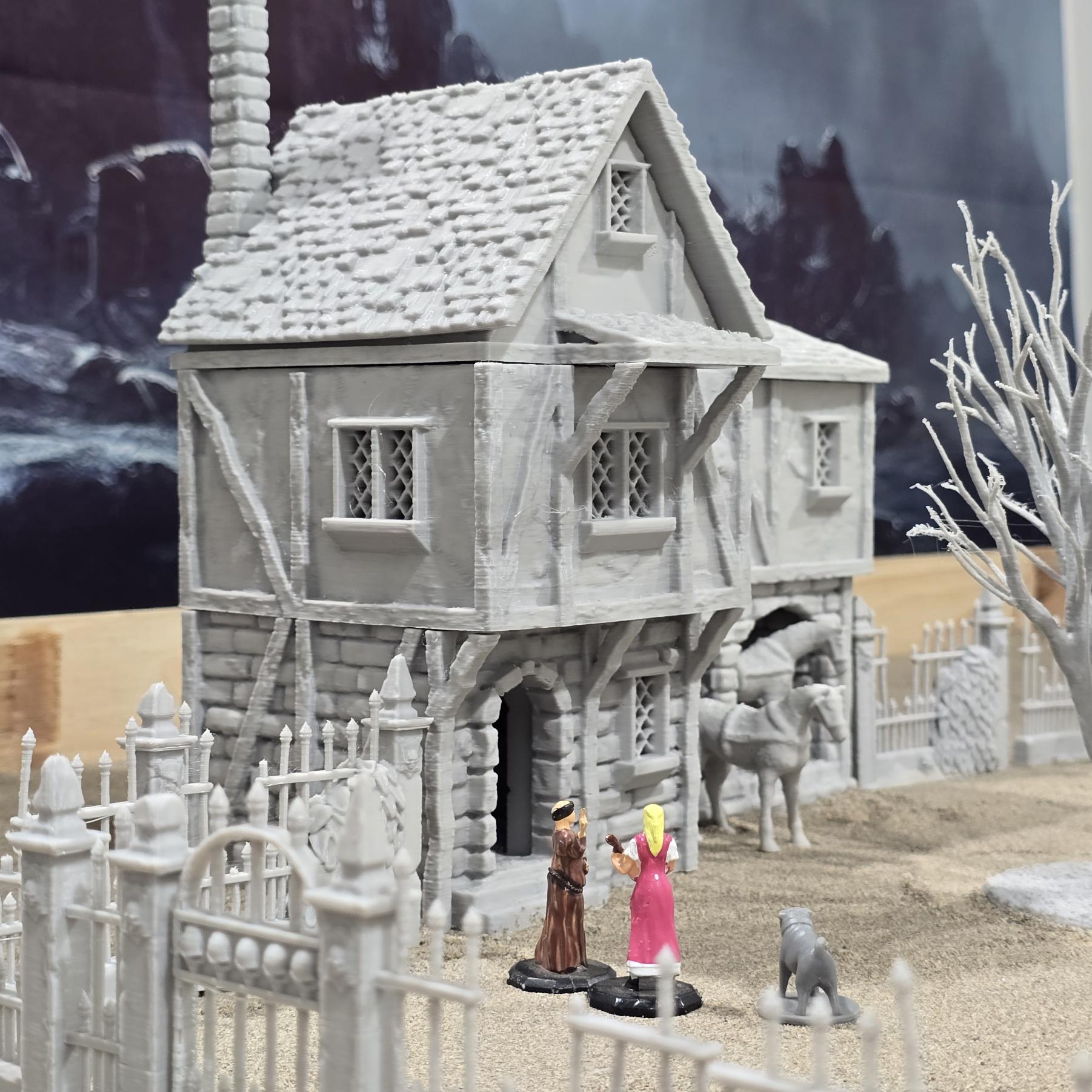 Exquisite 3D printed homestead model with detailed house, fencing, and barren trees, set against a rugged backdrop, perfect for tabletop games and dioramas.