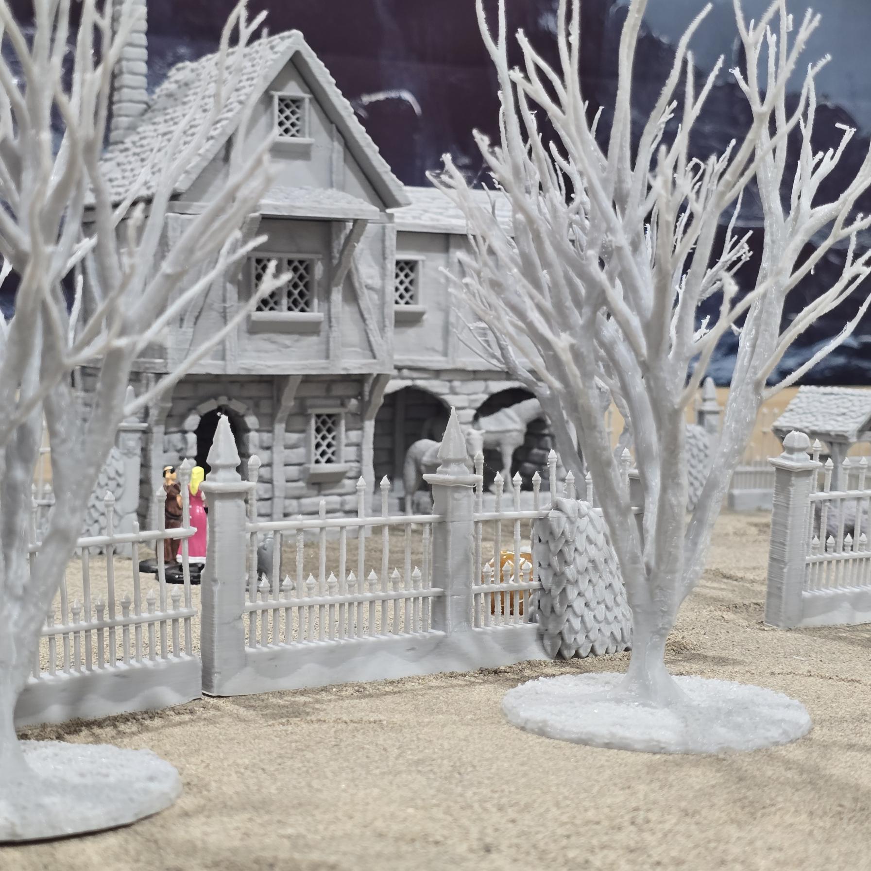 Exquisite 3D printed homestead model with detailed house, fencing, and barren trees, set against a rugged backdrop, perfect for tabletop games and dioramas.