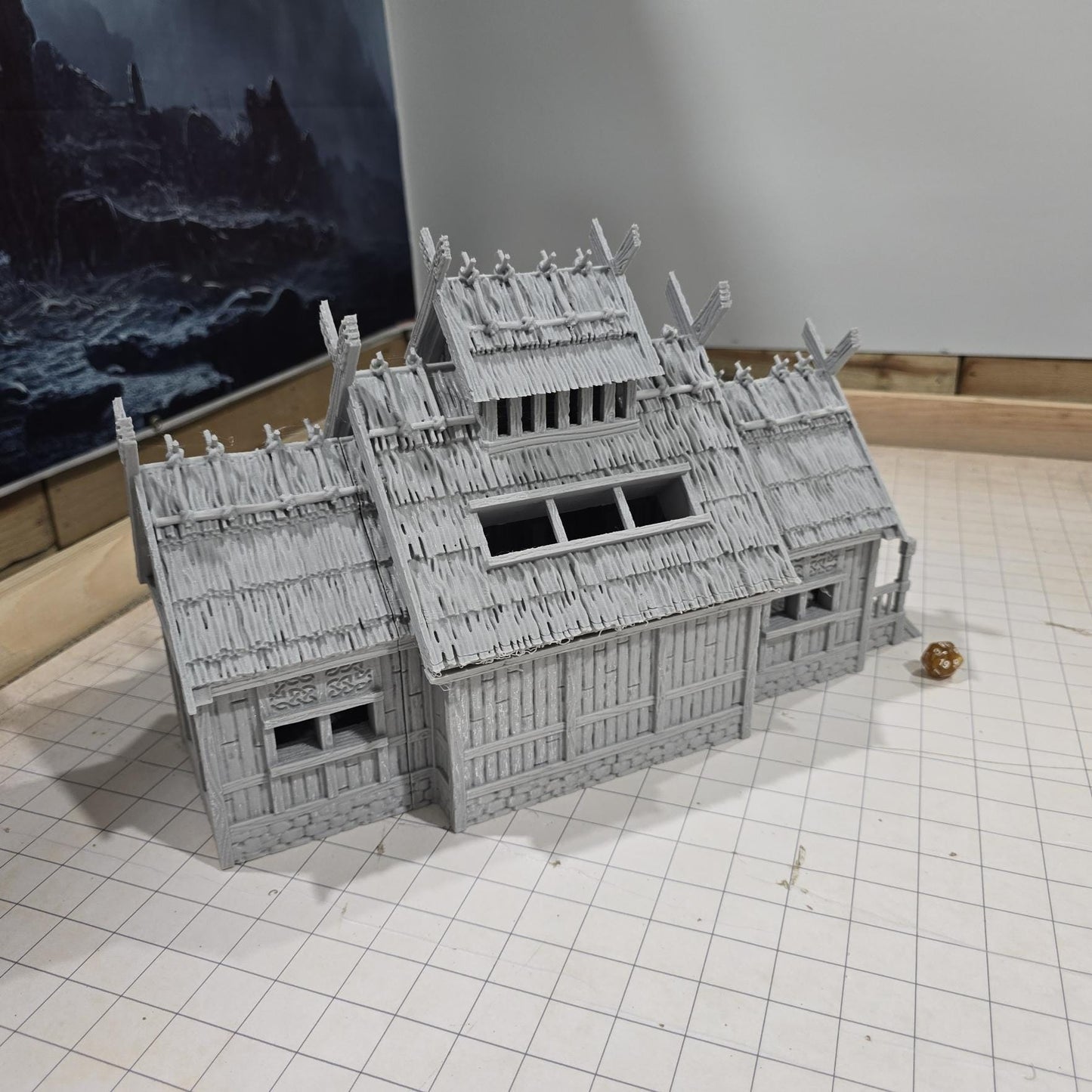 The Viking Era Nordic Longhouse by DarkRealmsForge features traditional Norse carvings and rugged wooden textures, ideal for historical RPGs and reenactment skirmish games.