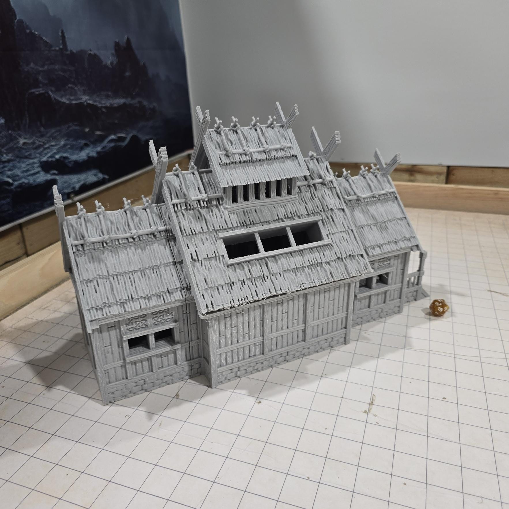 The Viking Era Nordic Longhouse by DarkRealmsForge features traditional Norse carvings and rugged wooden textures, ideal for historical RPGs and reenactment skirmish games.