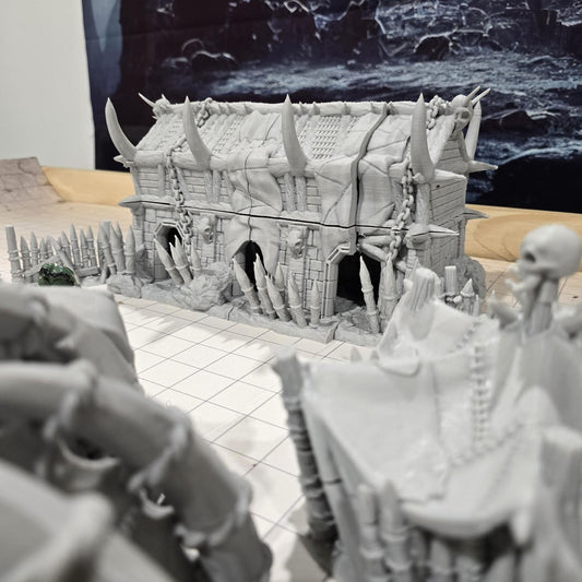 Discover an Orc Encampment with towers, tents, and defenses, intricately designed for tabletop warfare and fantasy role-playing games.