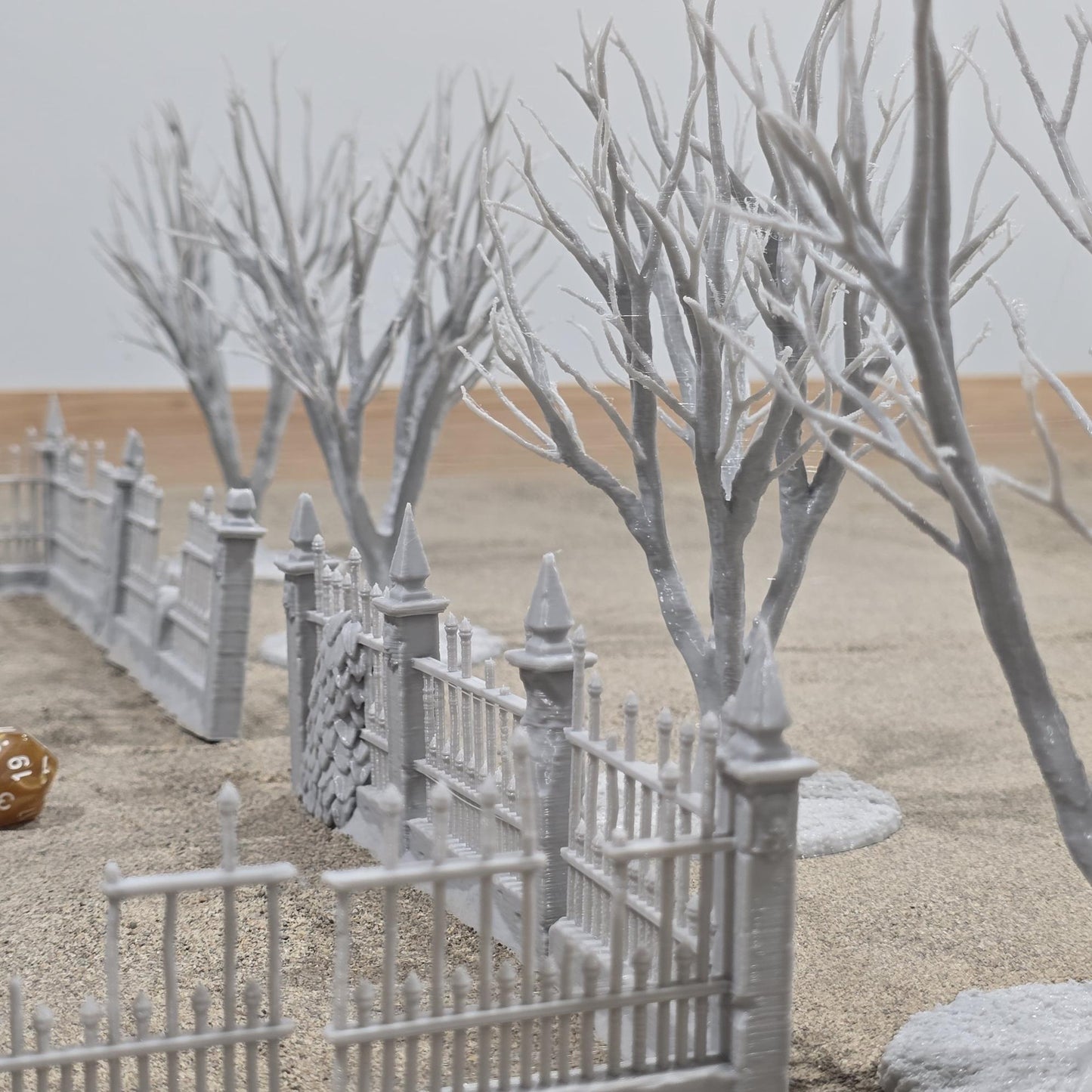 Exquisite 3D printed homestead model with detailed house, fencing, and barren trees, set against a rugged backdrop, perfect for tabletop games and dioramas.